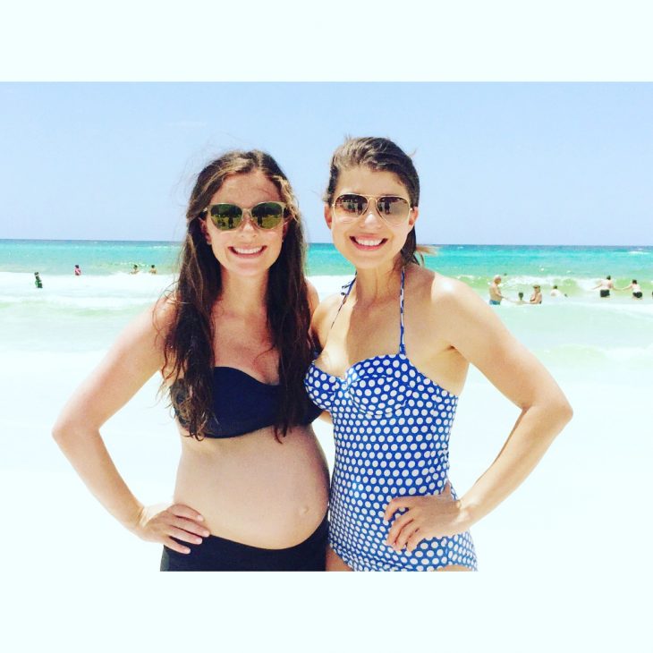 Pregnant woman with non-pregnant friend at the beach
