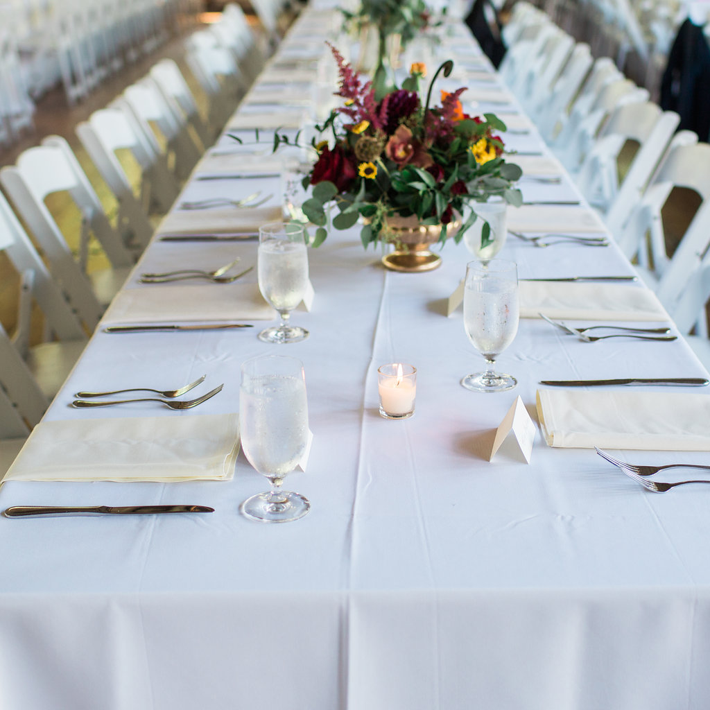 Family Style Tables at Wedding with Fresh Flowers and Vintage Glass Vases