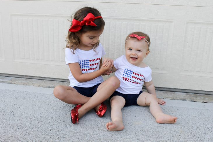 Sisters wearing Fourth of July Outfits