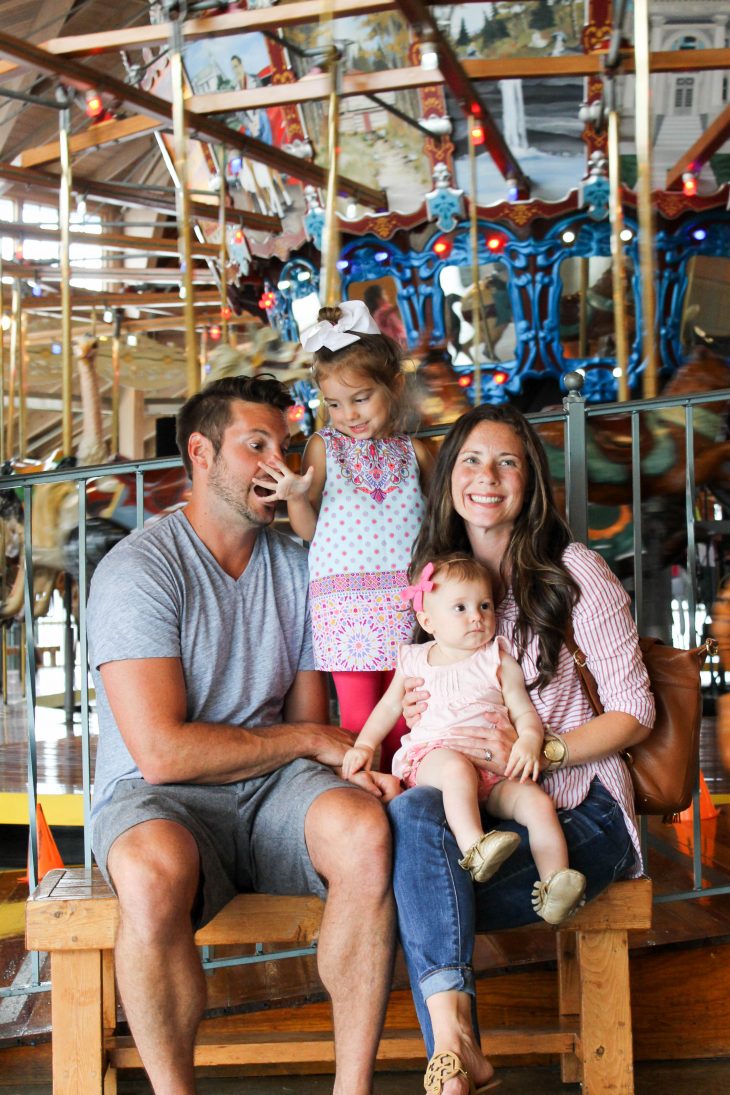 Family Photo in Front of Carousel