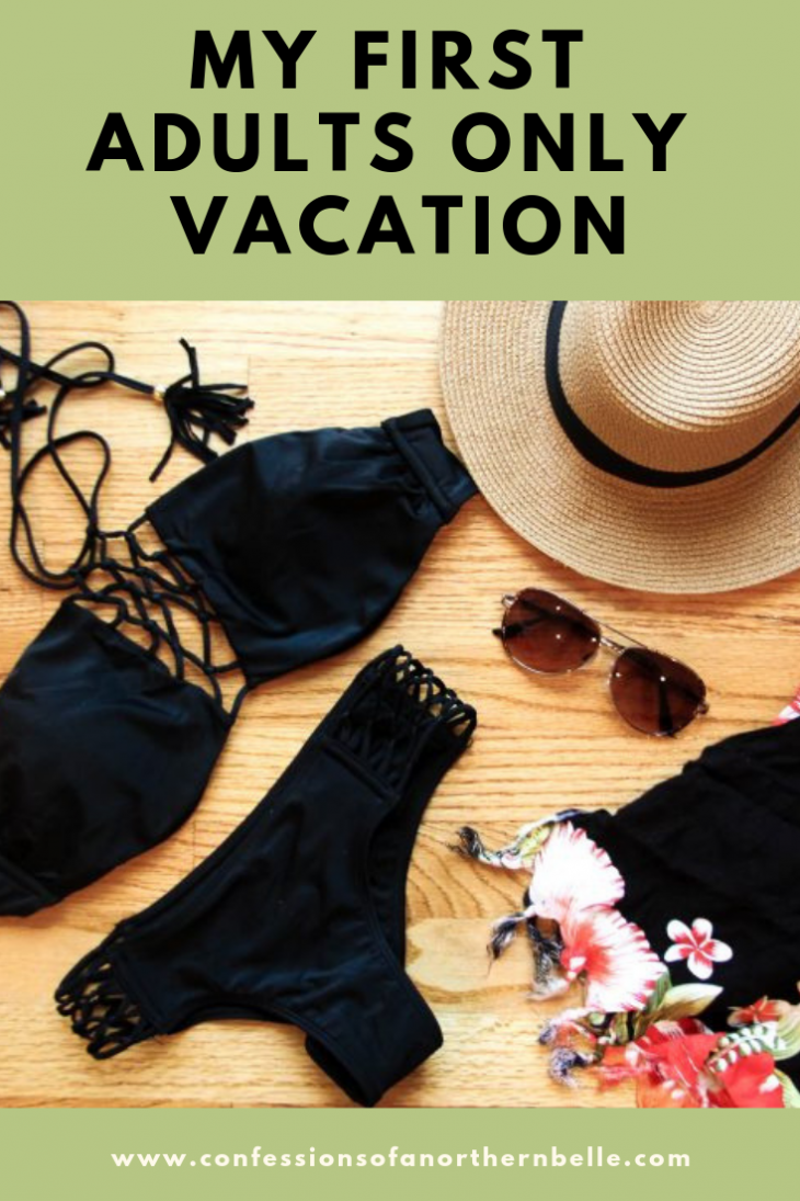 Black Bathing Suit Flat Lay with Sunglasses, Floral sarong, and Straw Beach Hat