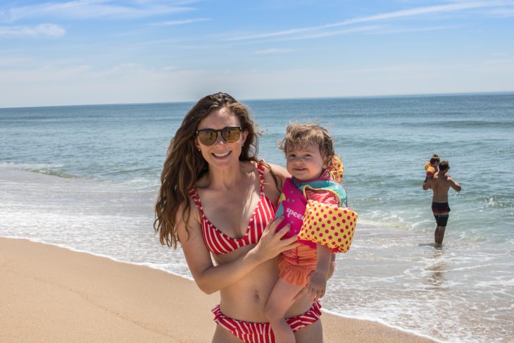 Mom in a Swimsuit Holding Child