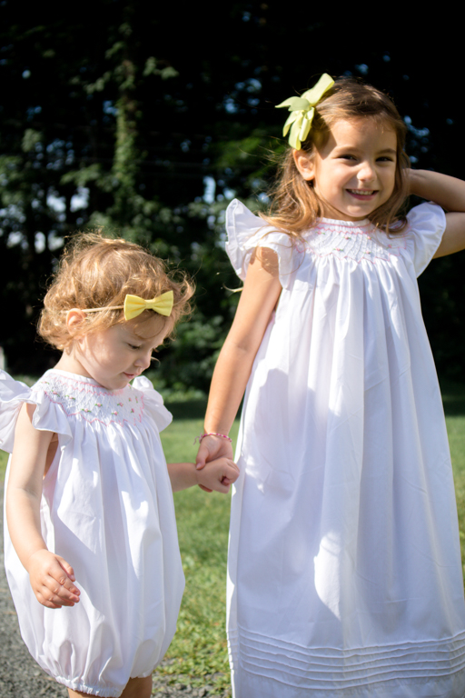 little girls in white summer sun dresses