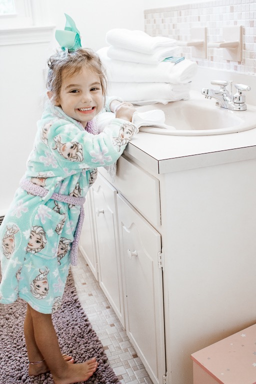 Little Girl Washing Hands in Bathroom