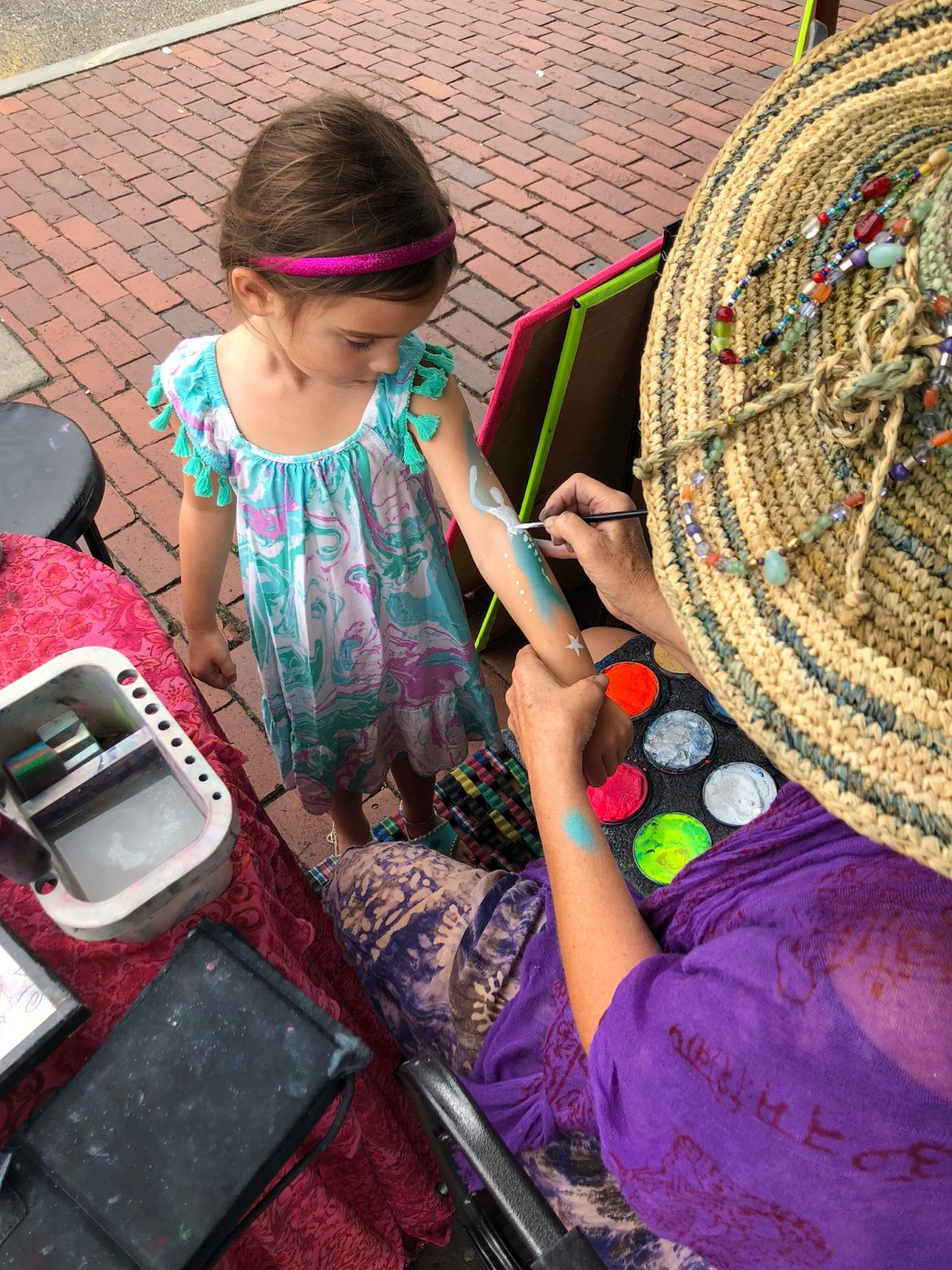 little girl with arm painting in provincetown ma