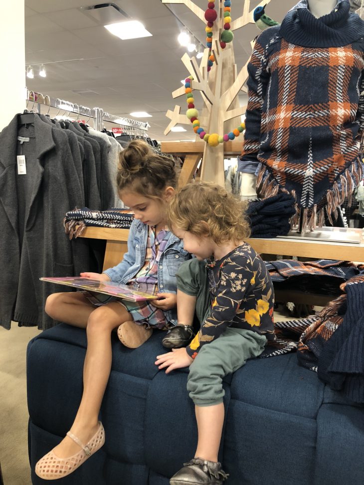 Boscov's - Sisters Reading on the Couch While Mommy Shops