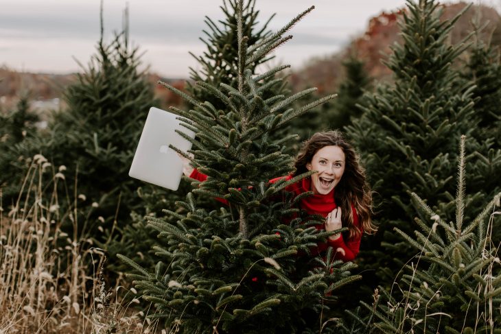 Woman behind Christmas Tree in Dudley Stephens 