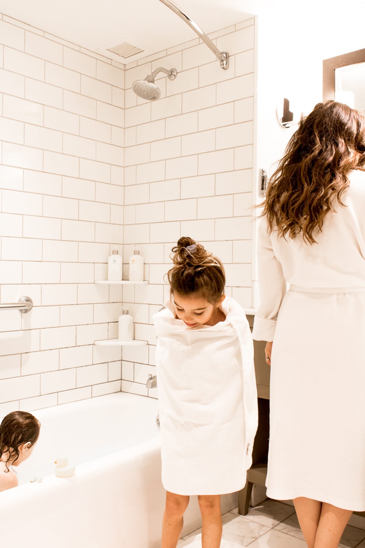 Mom and Daughters in Bathrobes and Towels at Woodstock Inn and Resort in Bathroom