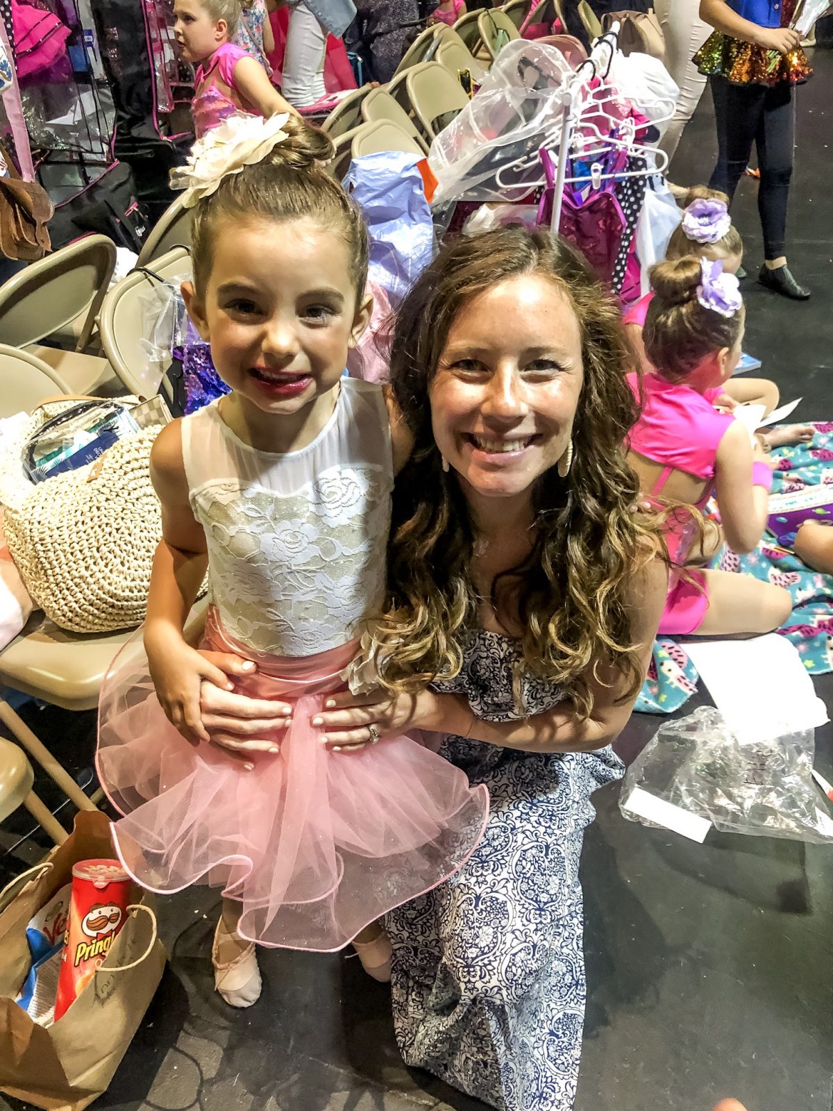 Ballerina after her dance recital with Mom