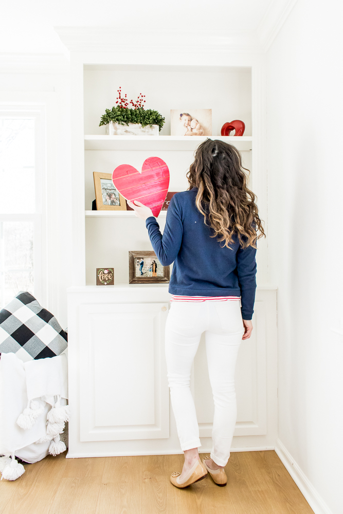 Blue Dudley Stephens Fleece with Red Stripe Shirt and White Denim in front of Valentine's Day Decor