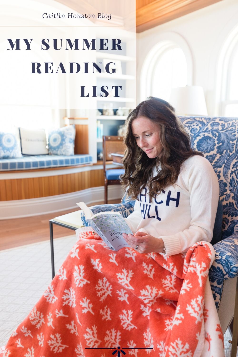 woman sitting with chappy wrap reading a book