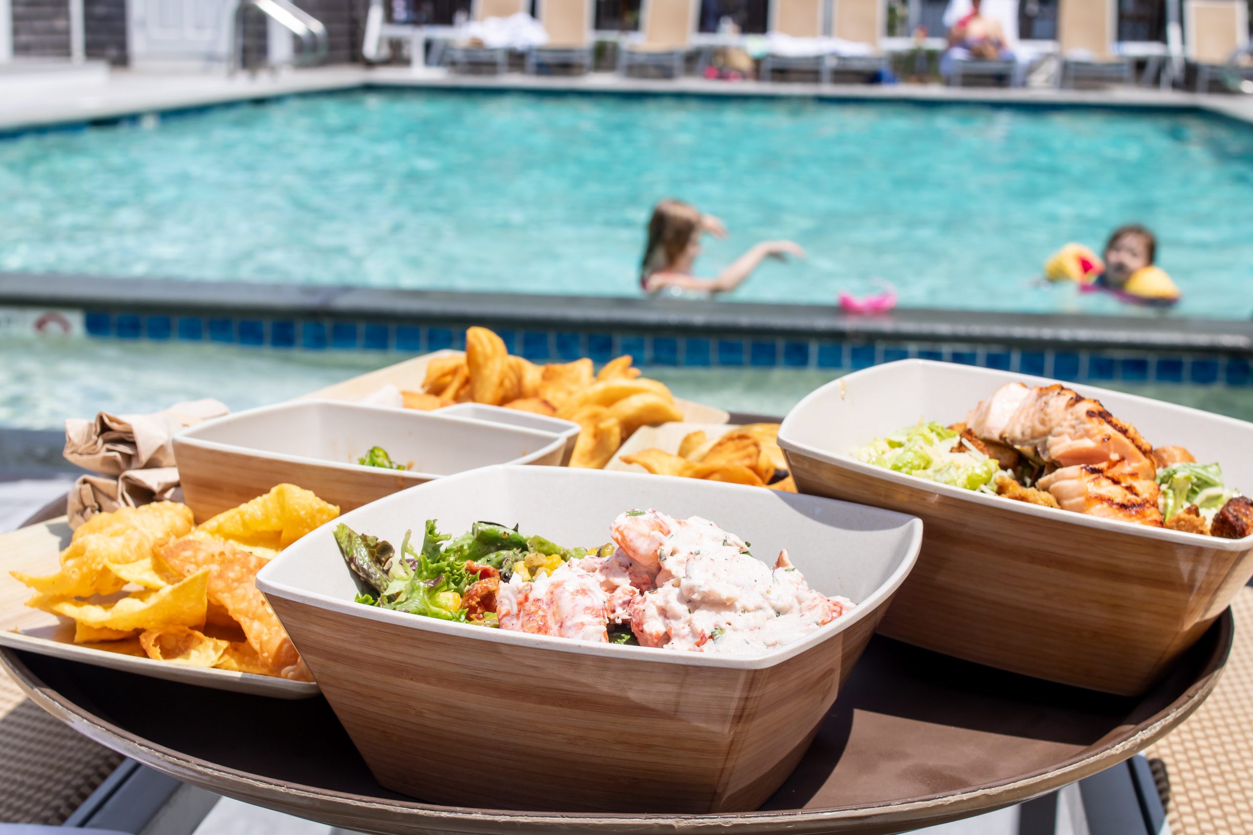 Poolside Lunch at the Nantucket Hotel from Breeze - featuring The Breeze Signature Salad topped with Lobster Salad and curly sea salt fries
