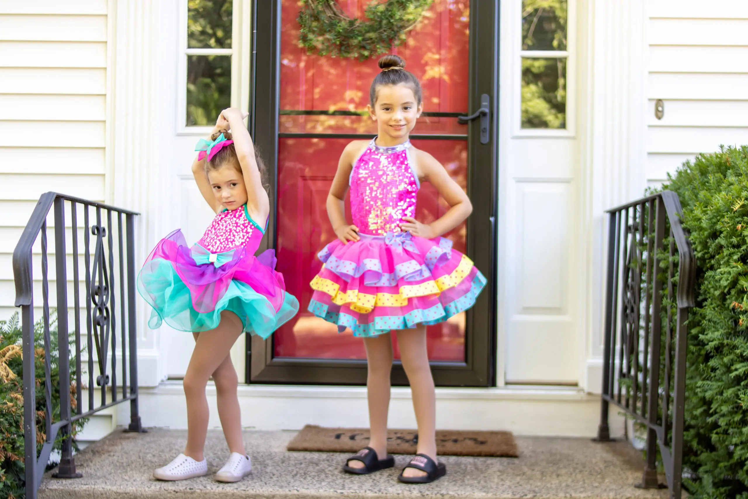 sisters in dance costumes for recital in July