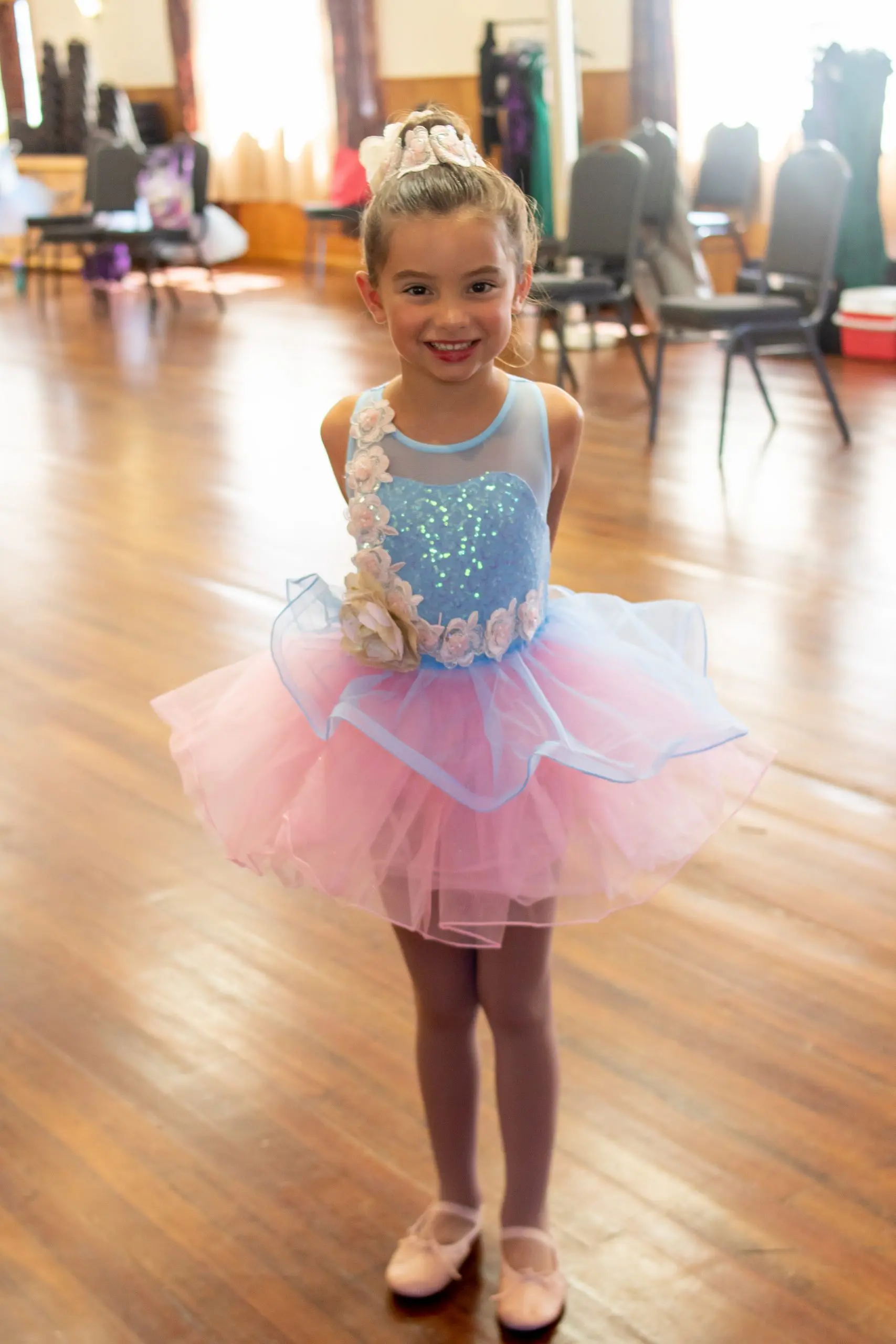 little girl in blue and pink ballet costume