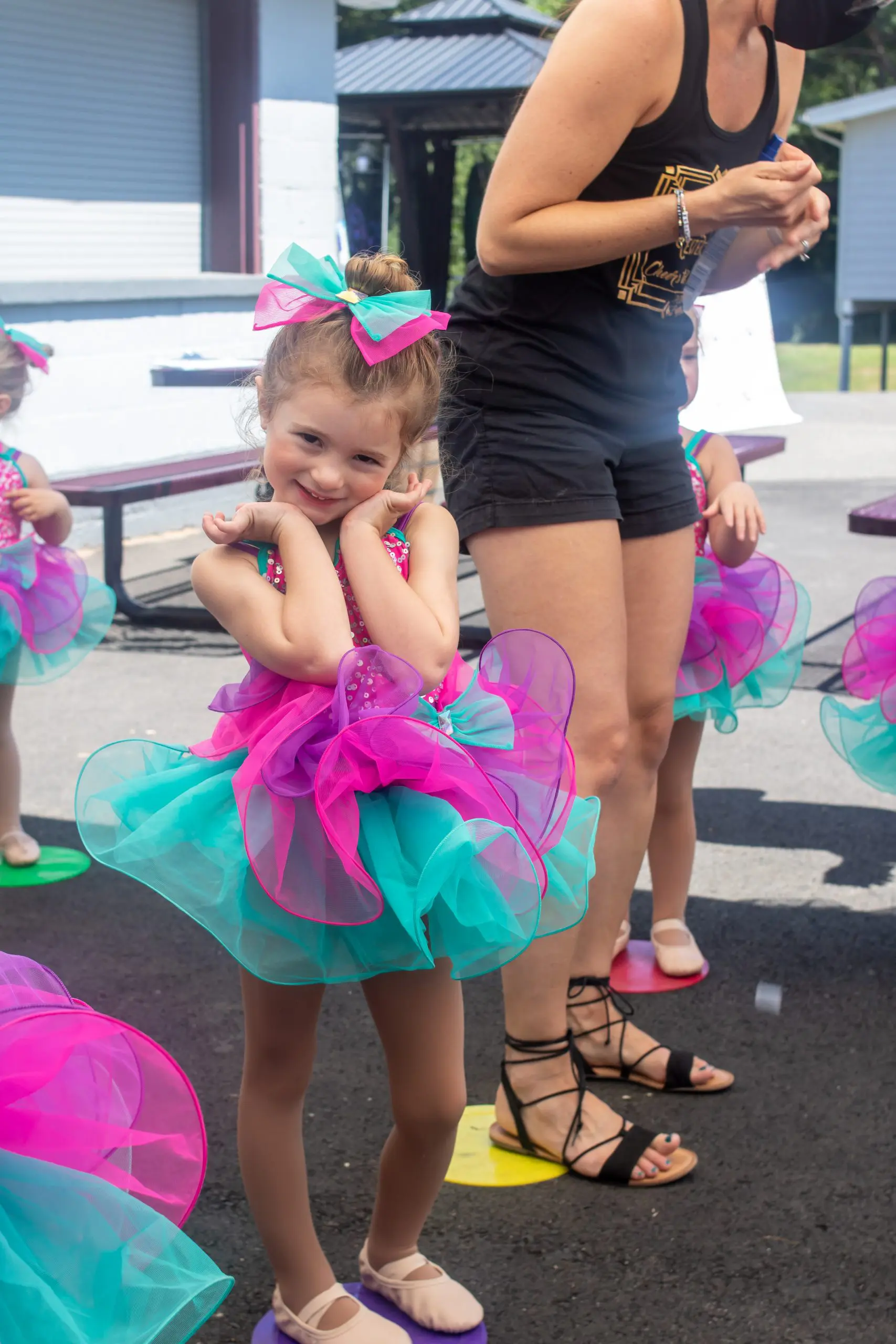 little girl in pink and purple ballet costume