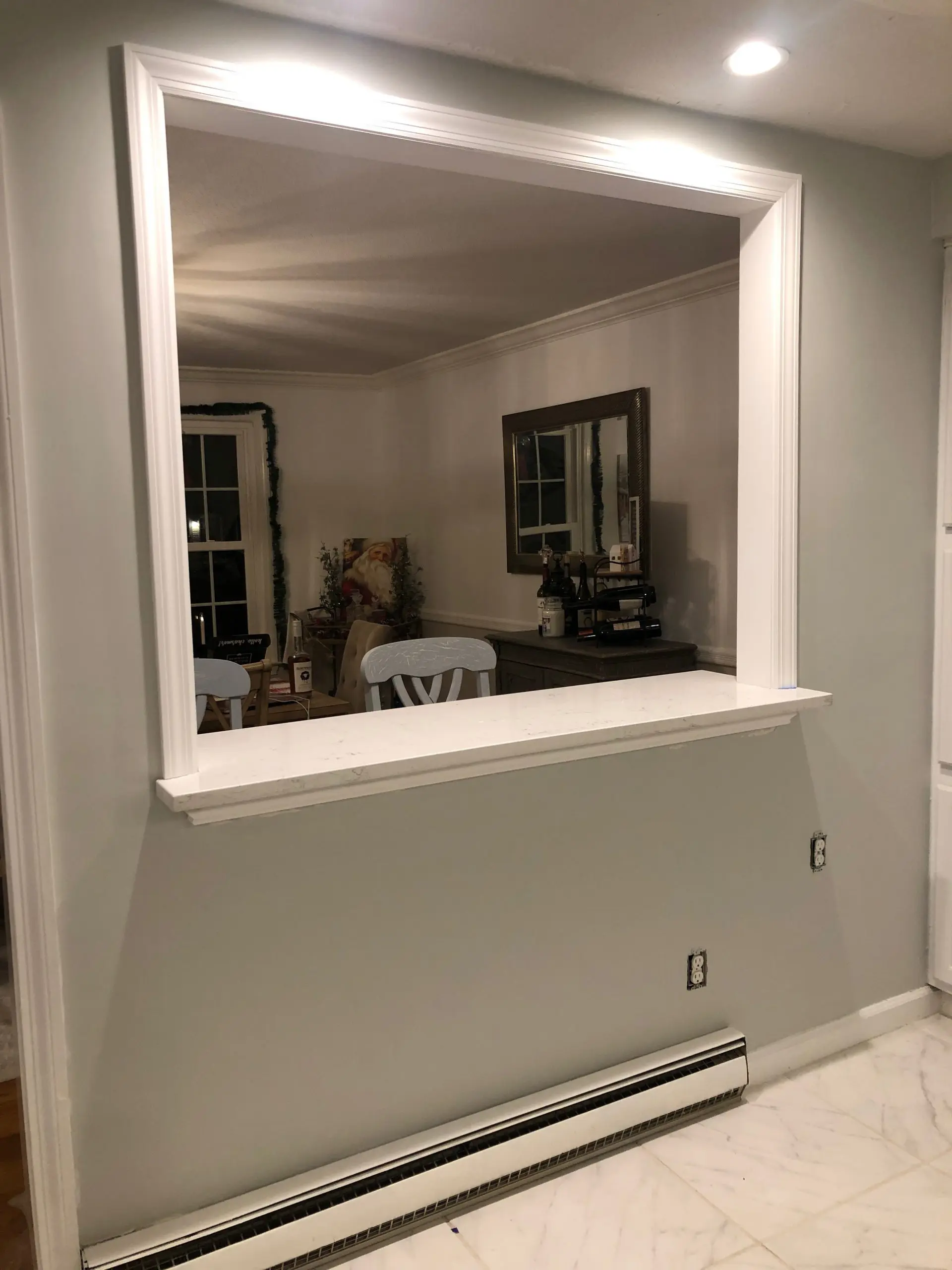 Half wall in kitchen with breakfast bar countertop quartz