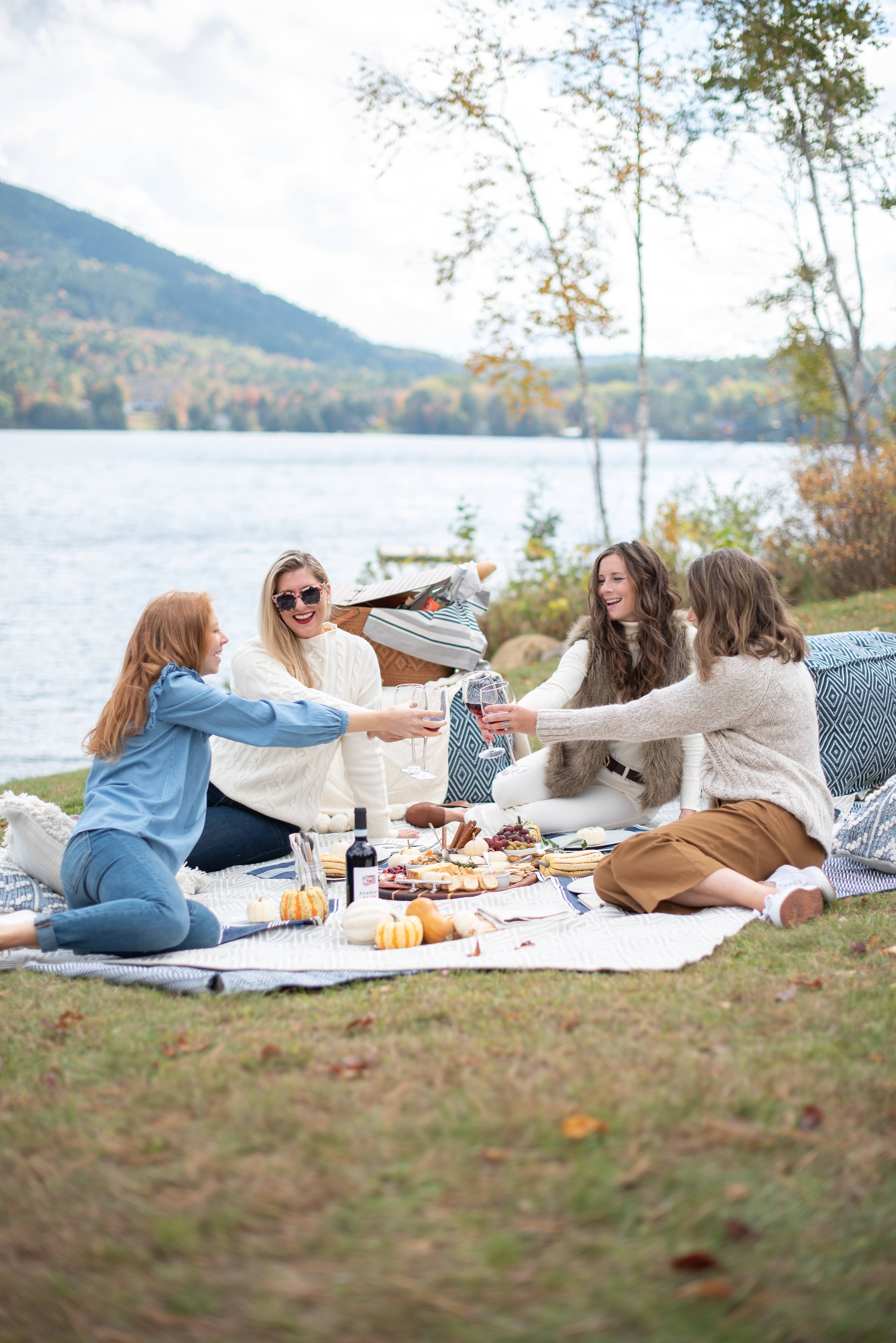 friends at a lakeside picnic in vermont with annie selke and 90 plus cellers
