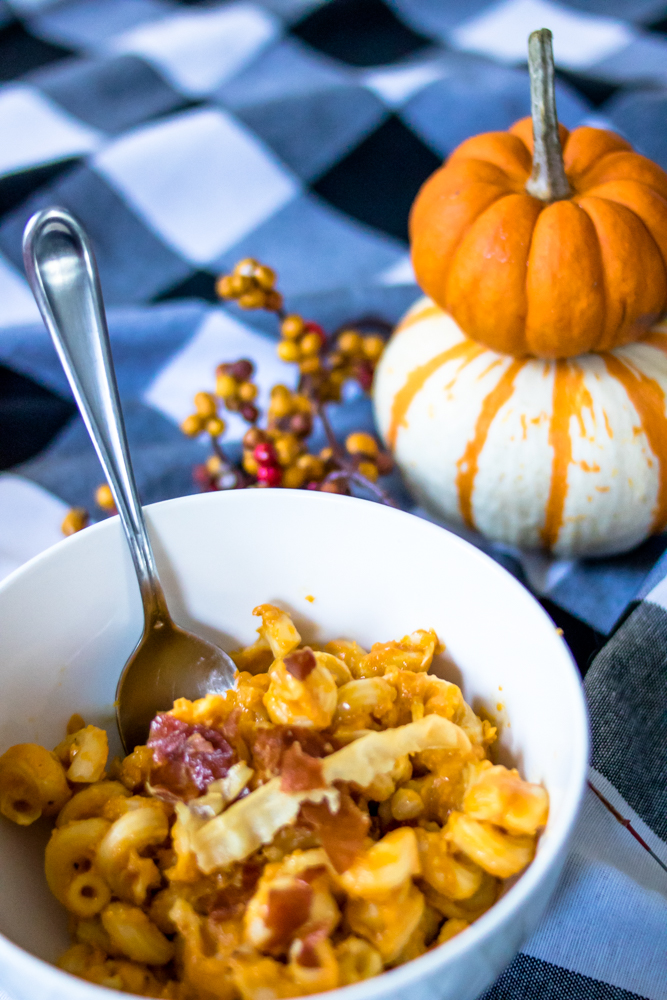 Pumpkin Macaroni and Cheese on a checkered tablecloth
