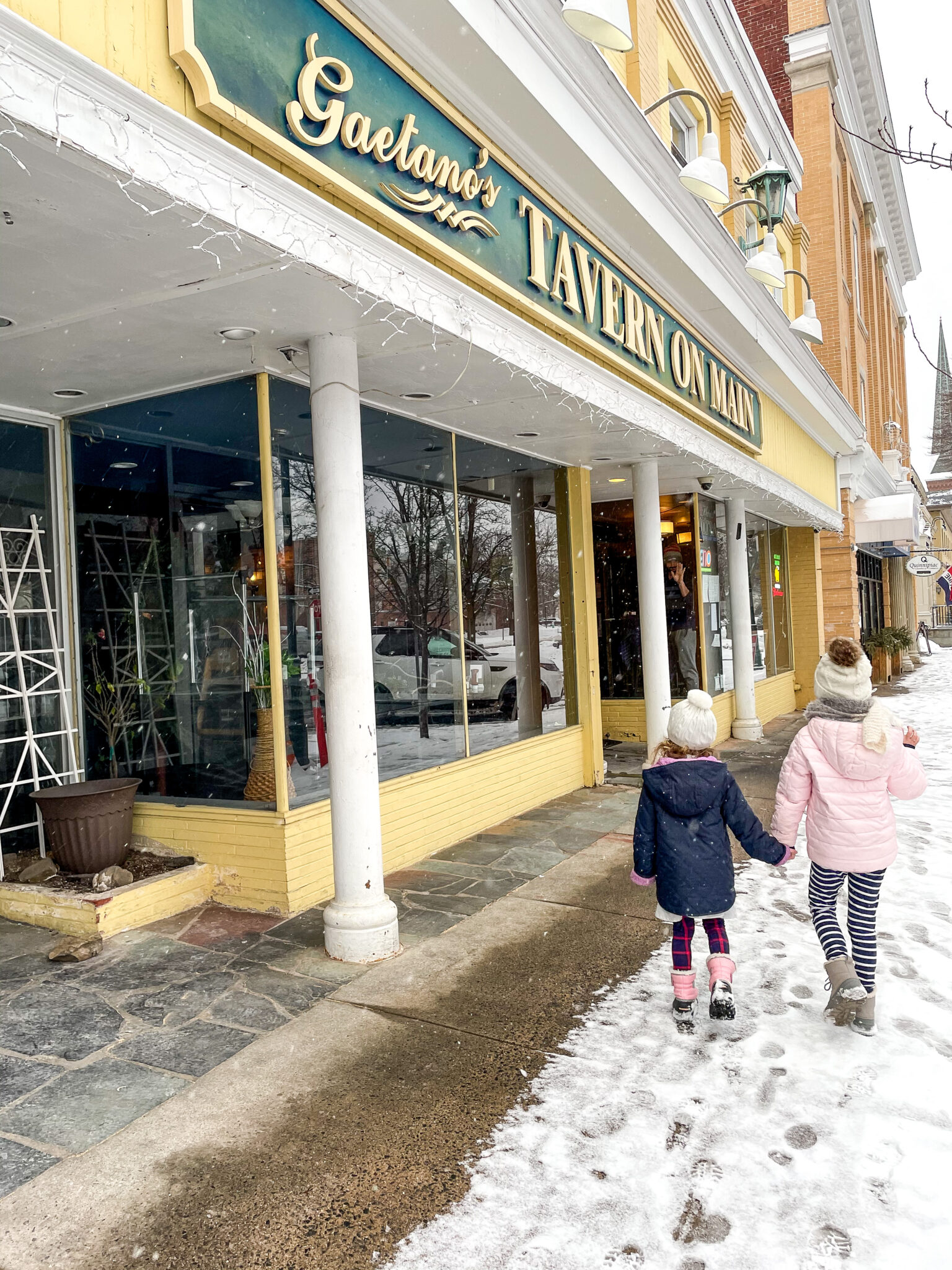 Little girls walking in the snow wallingford