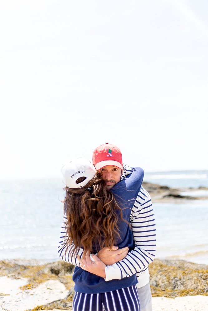 man hugging woman at beach