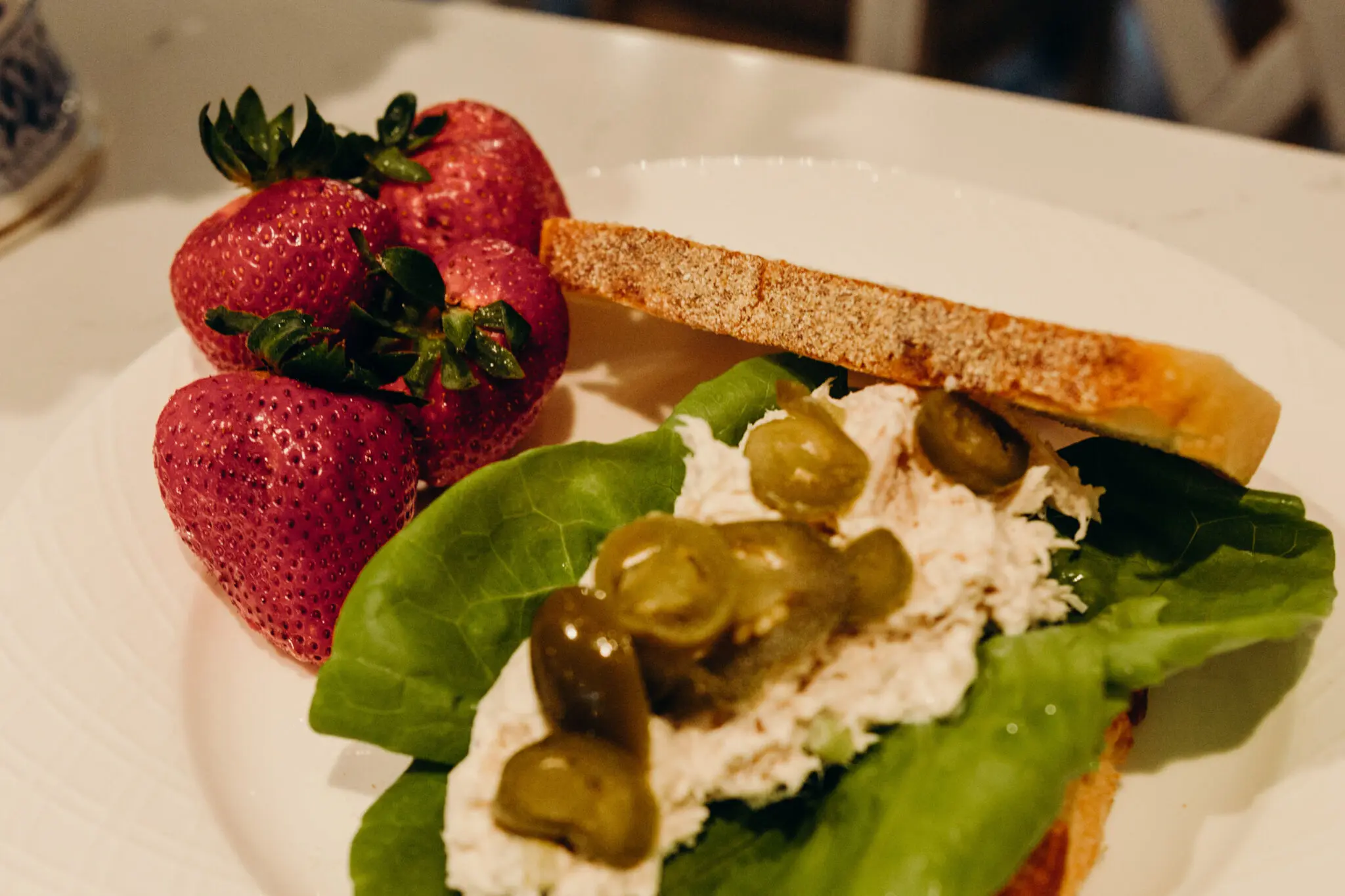 Chicken Salad Sandwich with Jalapenos on Sourdough and Side of Strawberries