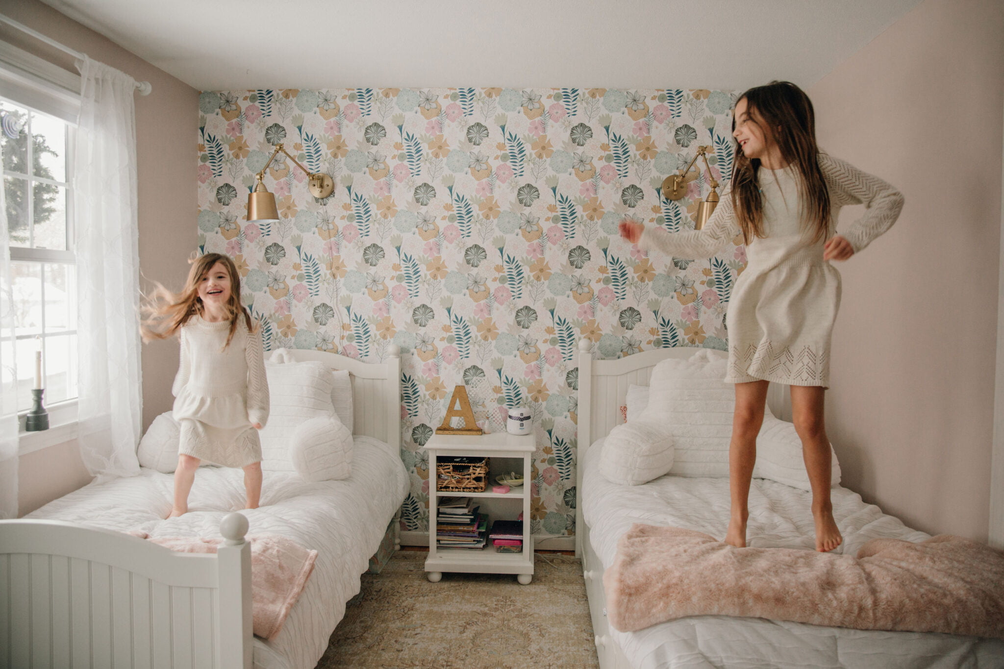 15 Fun Indoor Activities During Covid Girls Jumping on Bed