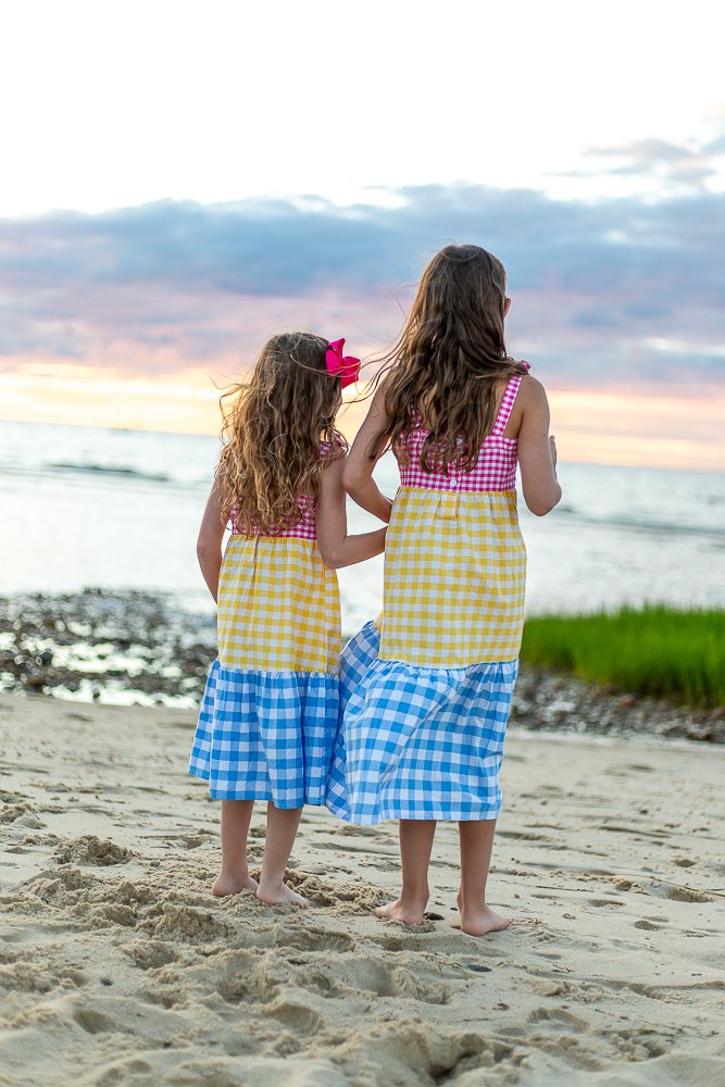 sisters on beach during sunset