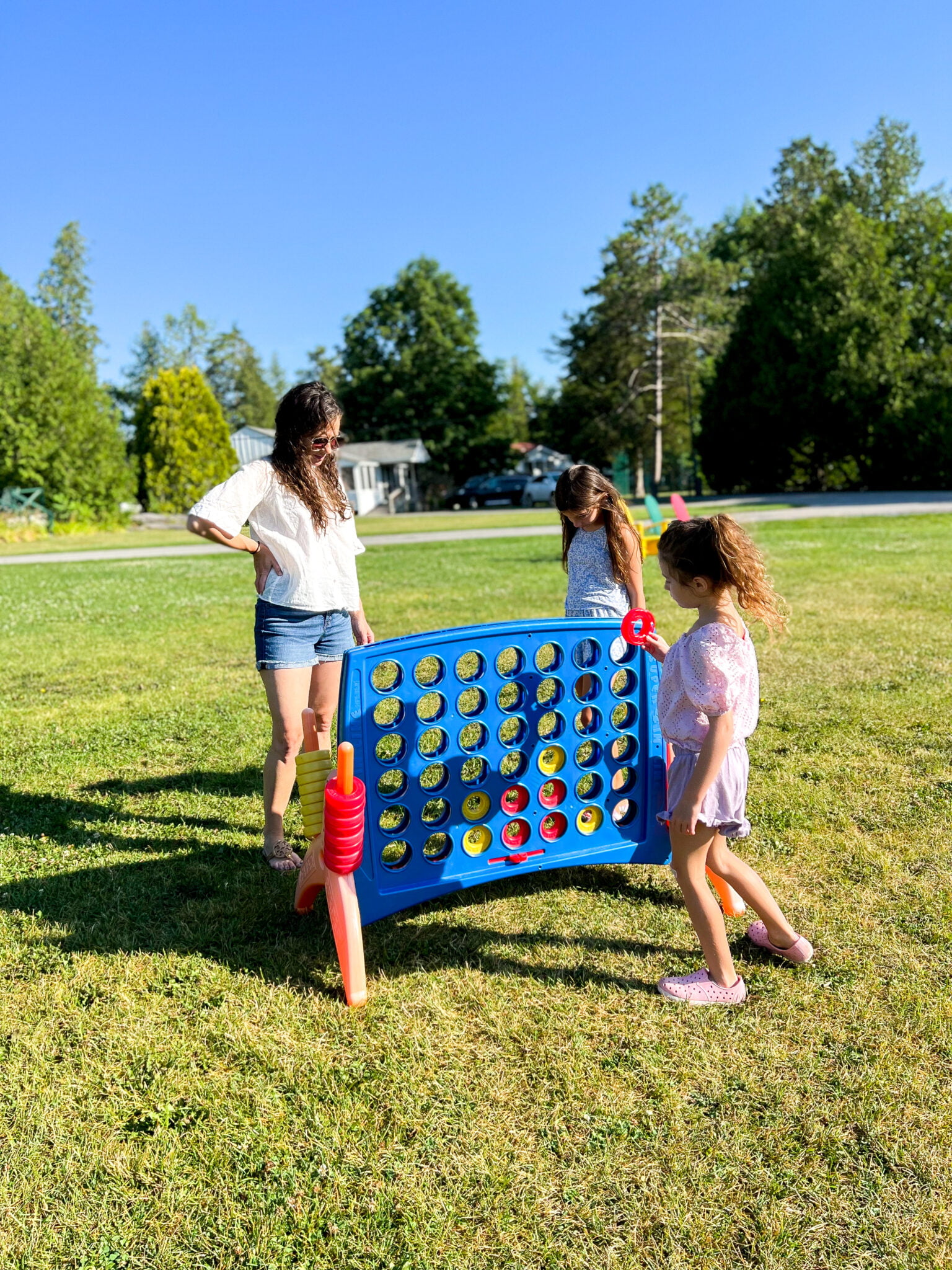 Family playing Giant Connect 4 Basin Harbor