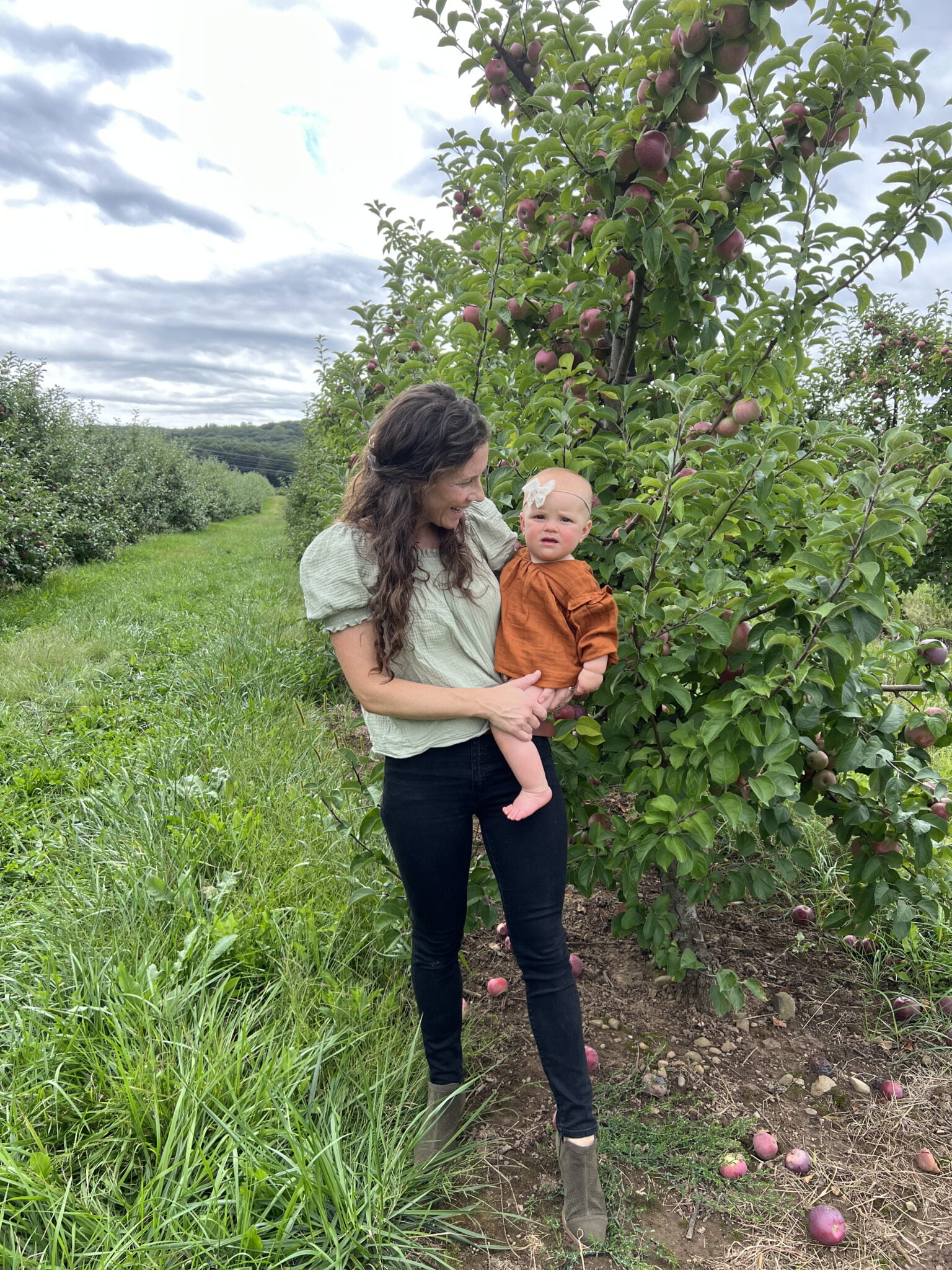 Mom and Baby in Apple Orchard