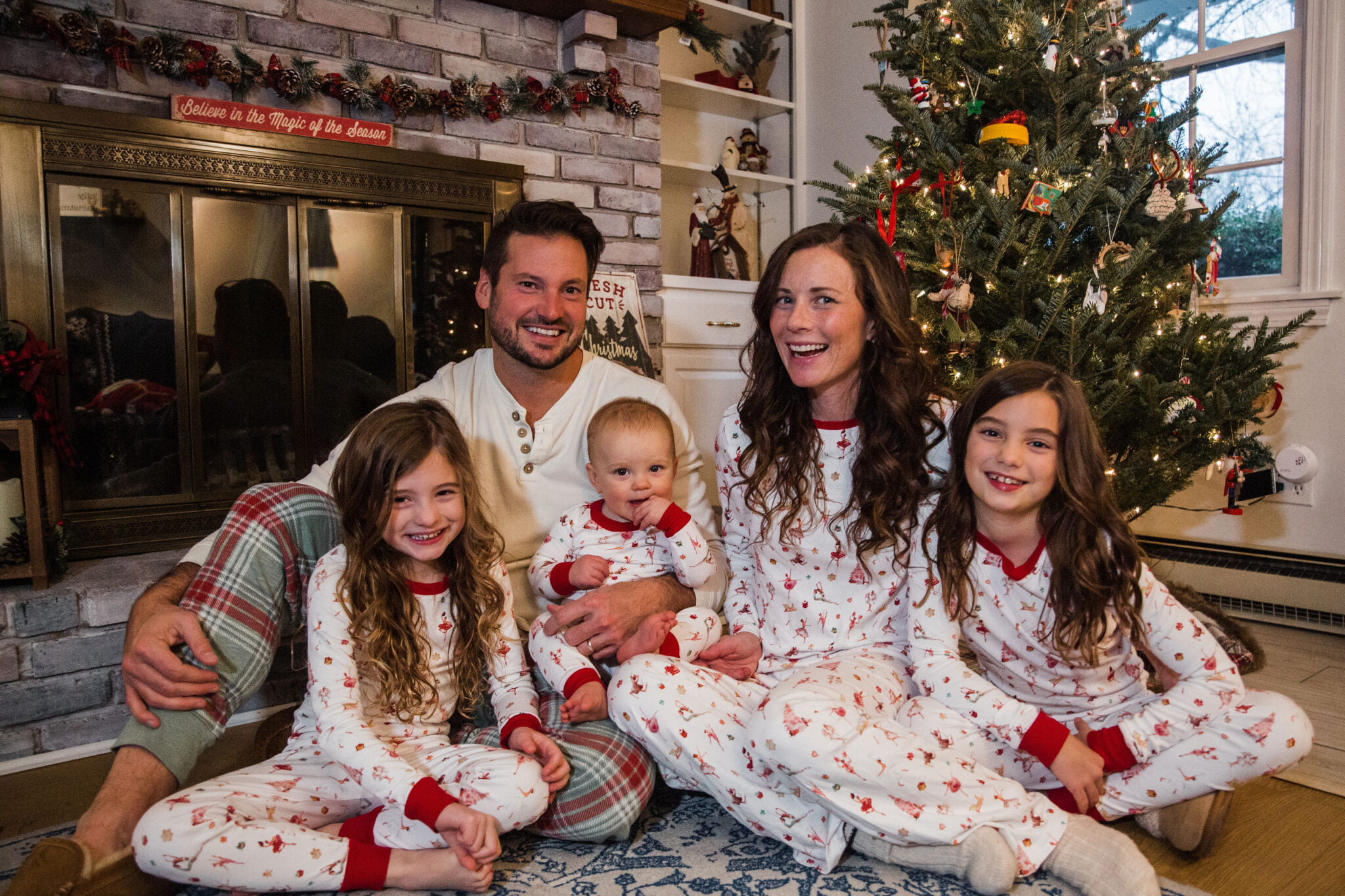 Family in Matching Christmas Pajamas by Tree and Fireplace Lake Pajamas Jcrew