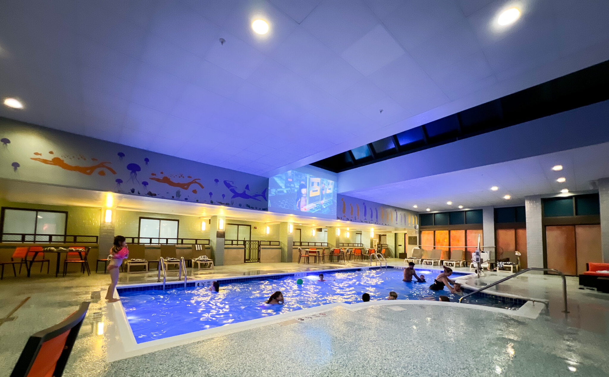 pool with kid movie screen Hilton Mystic