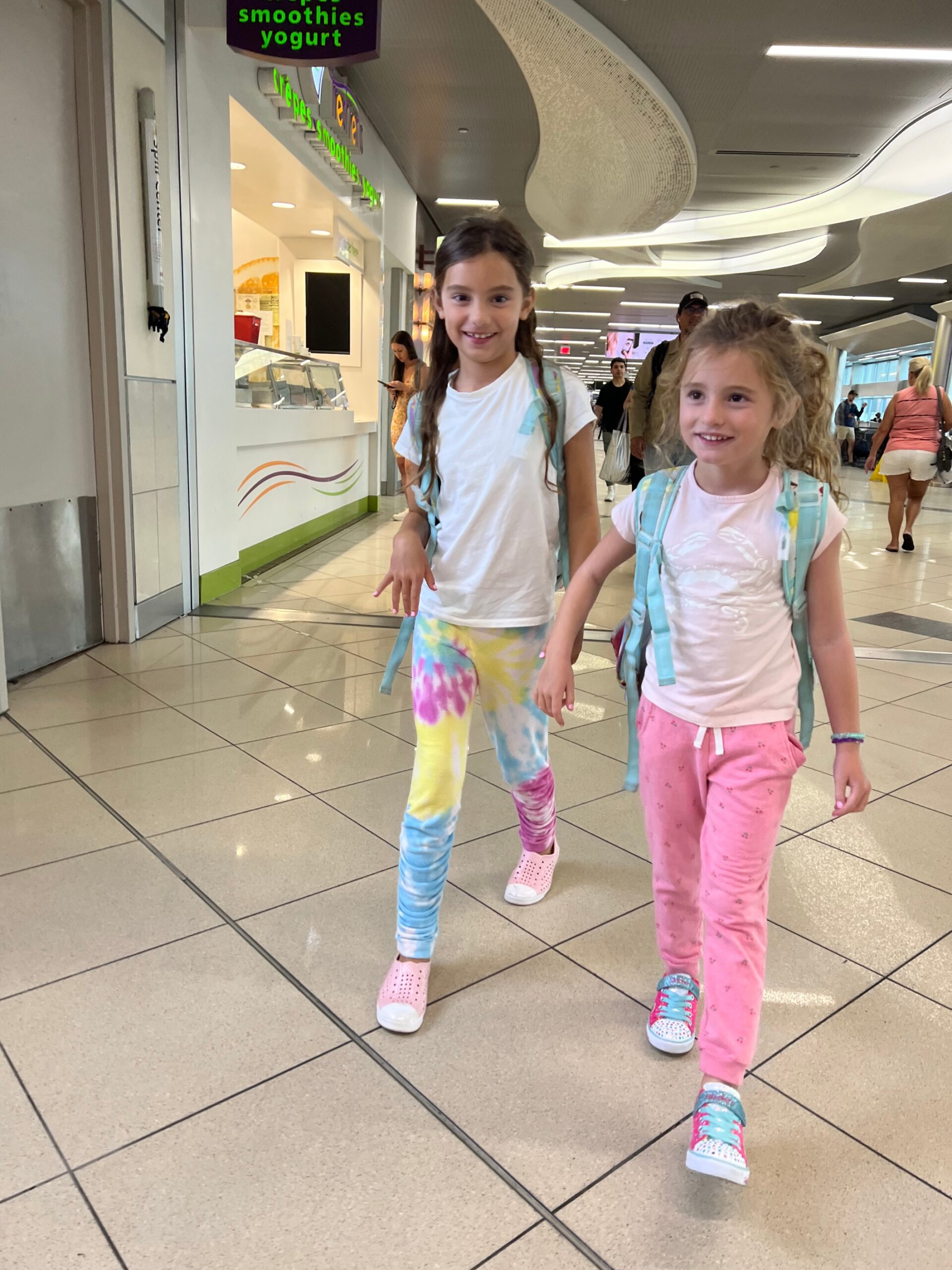 kids walking with backpacks at store for back to school shopping