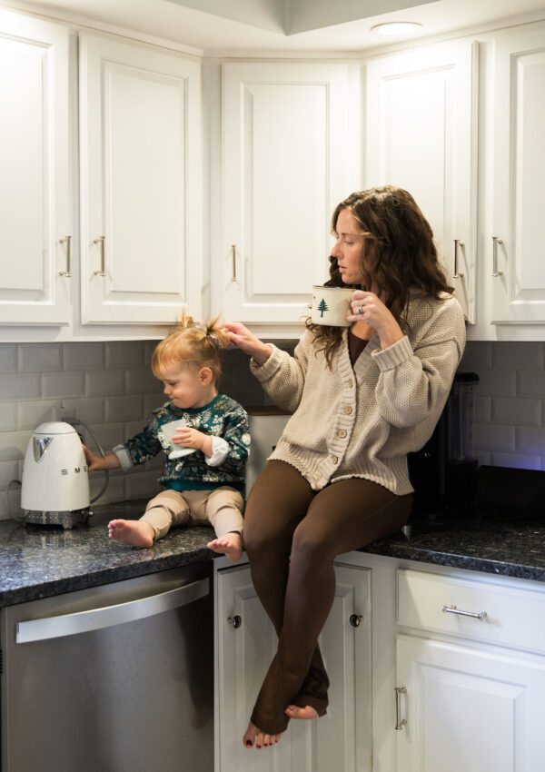 Mom Toddler Drinking Coffee on Kitchen Counter 0