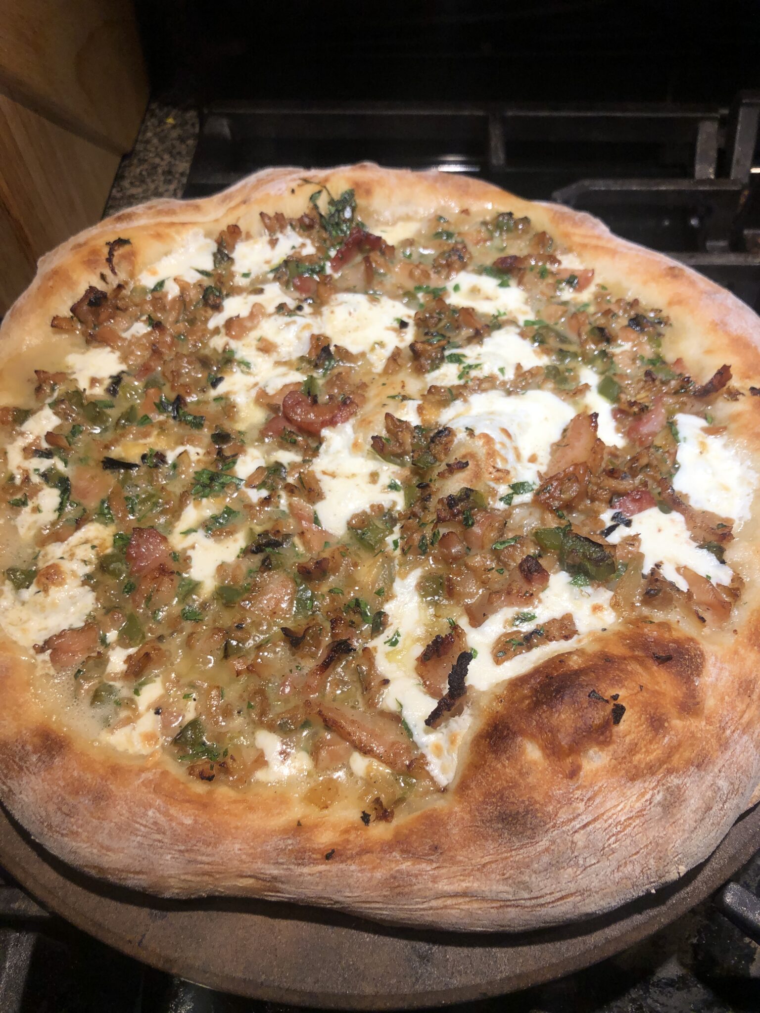 Homemade Pizza for family dinner on vacation - bacon ricotta sausage pizza