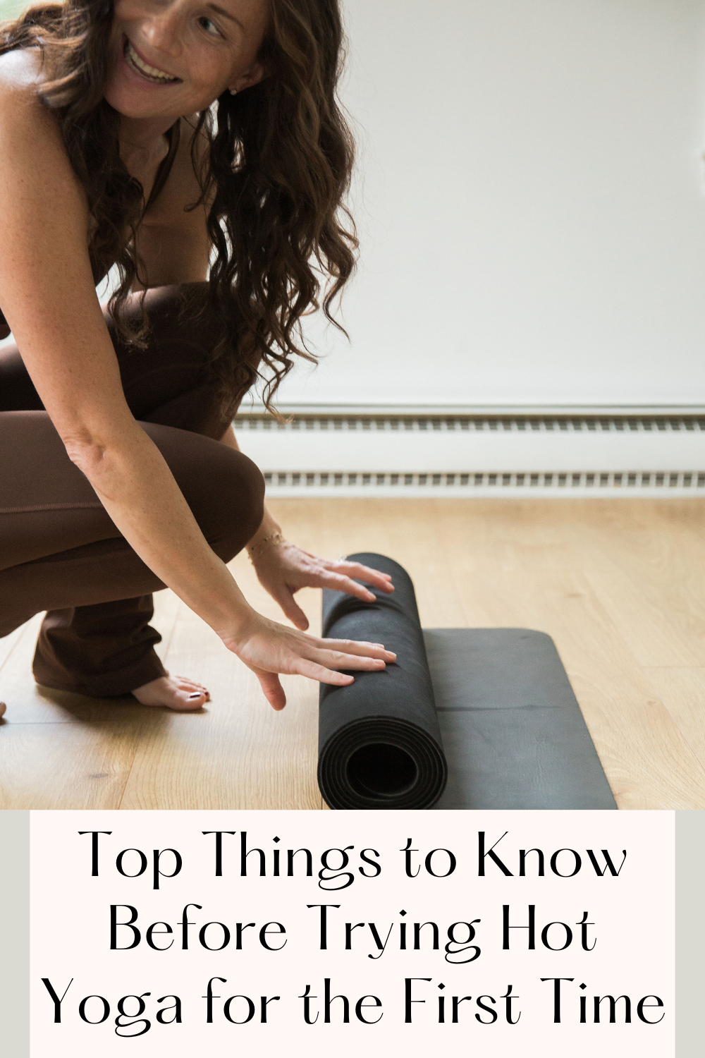 Hot Yoga Tips for Beginners woman rolling yoga mat