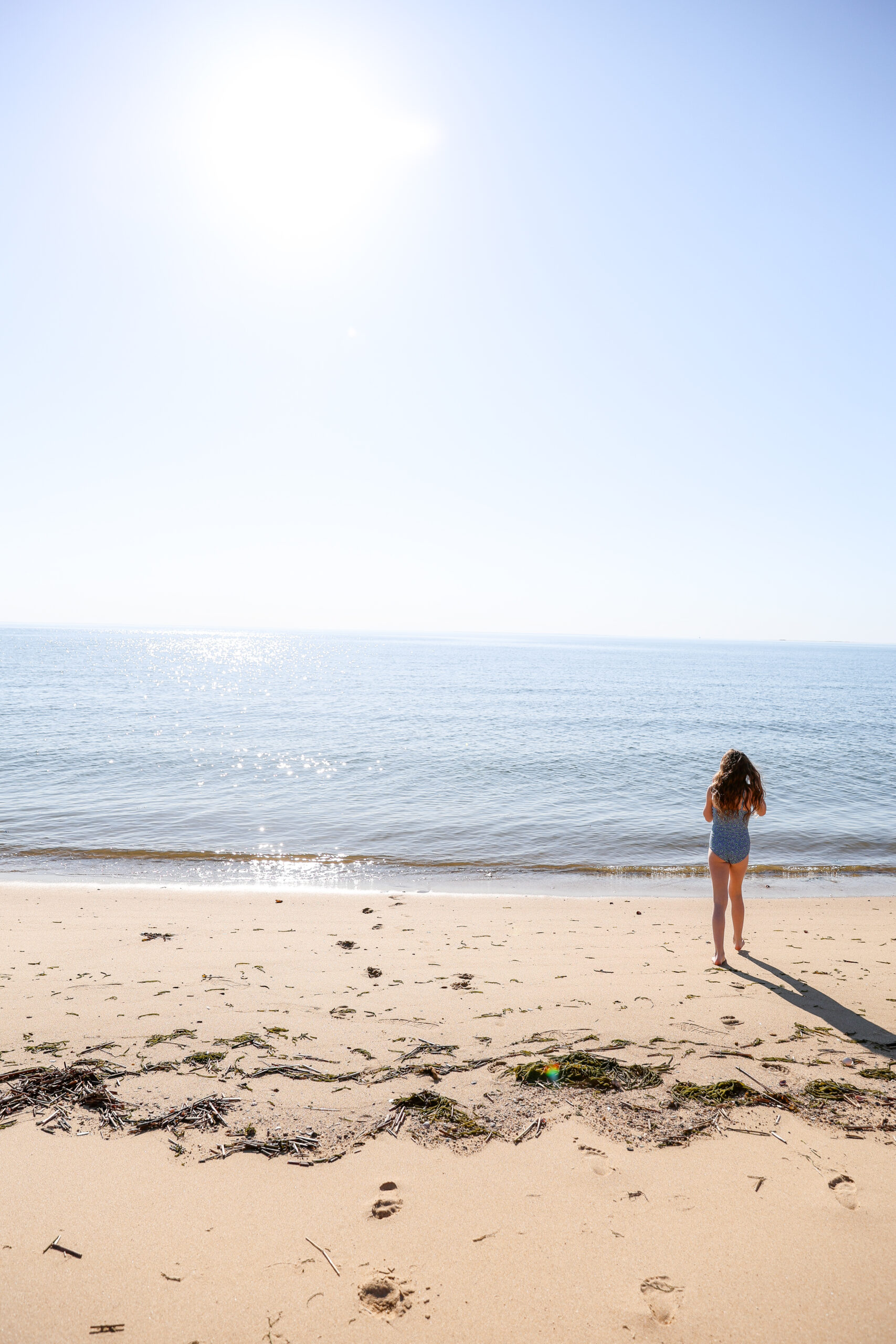 little girl walking into ocean in Eastham MA