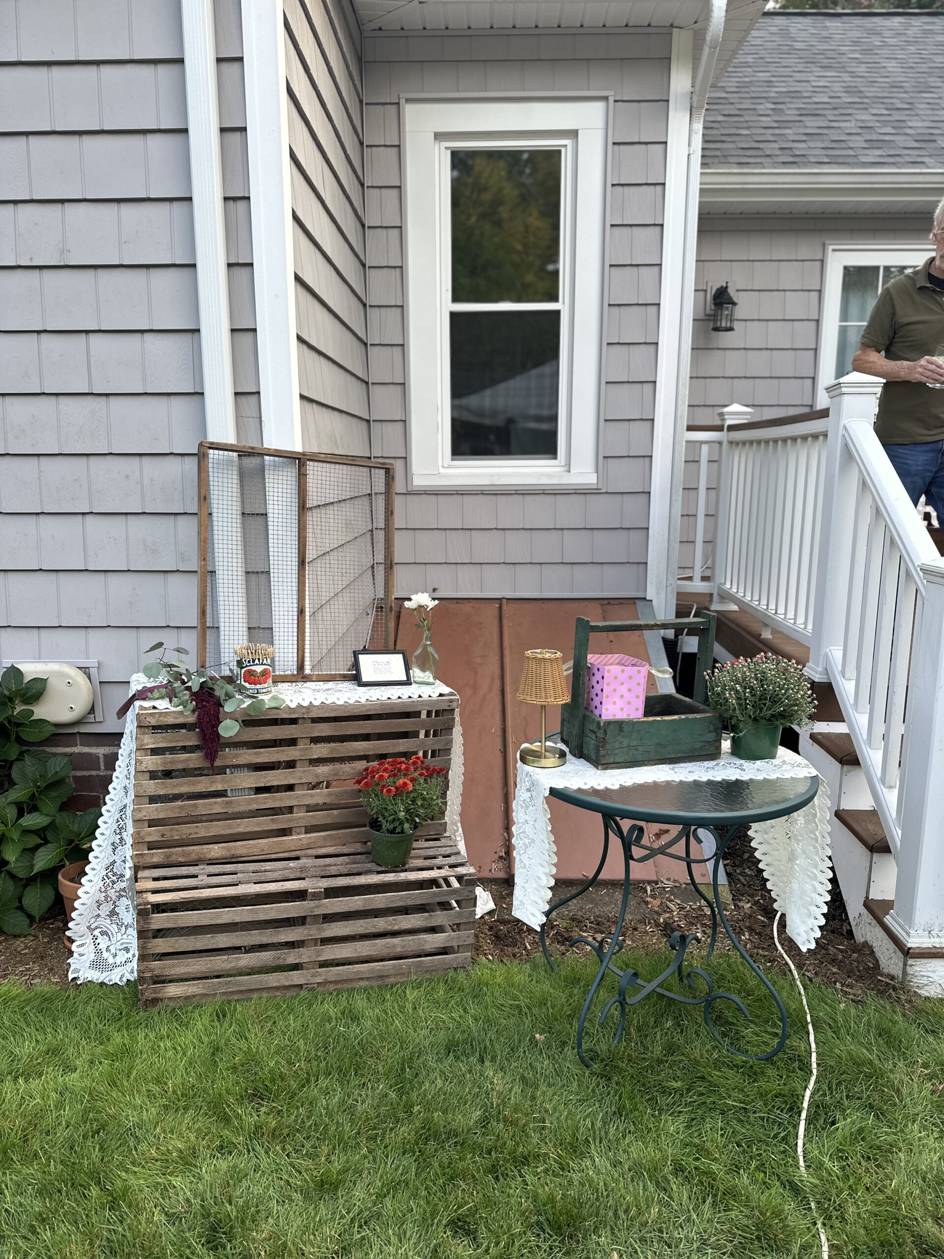 Lobster crates stacked with grated window and clothes pins to clip message