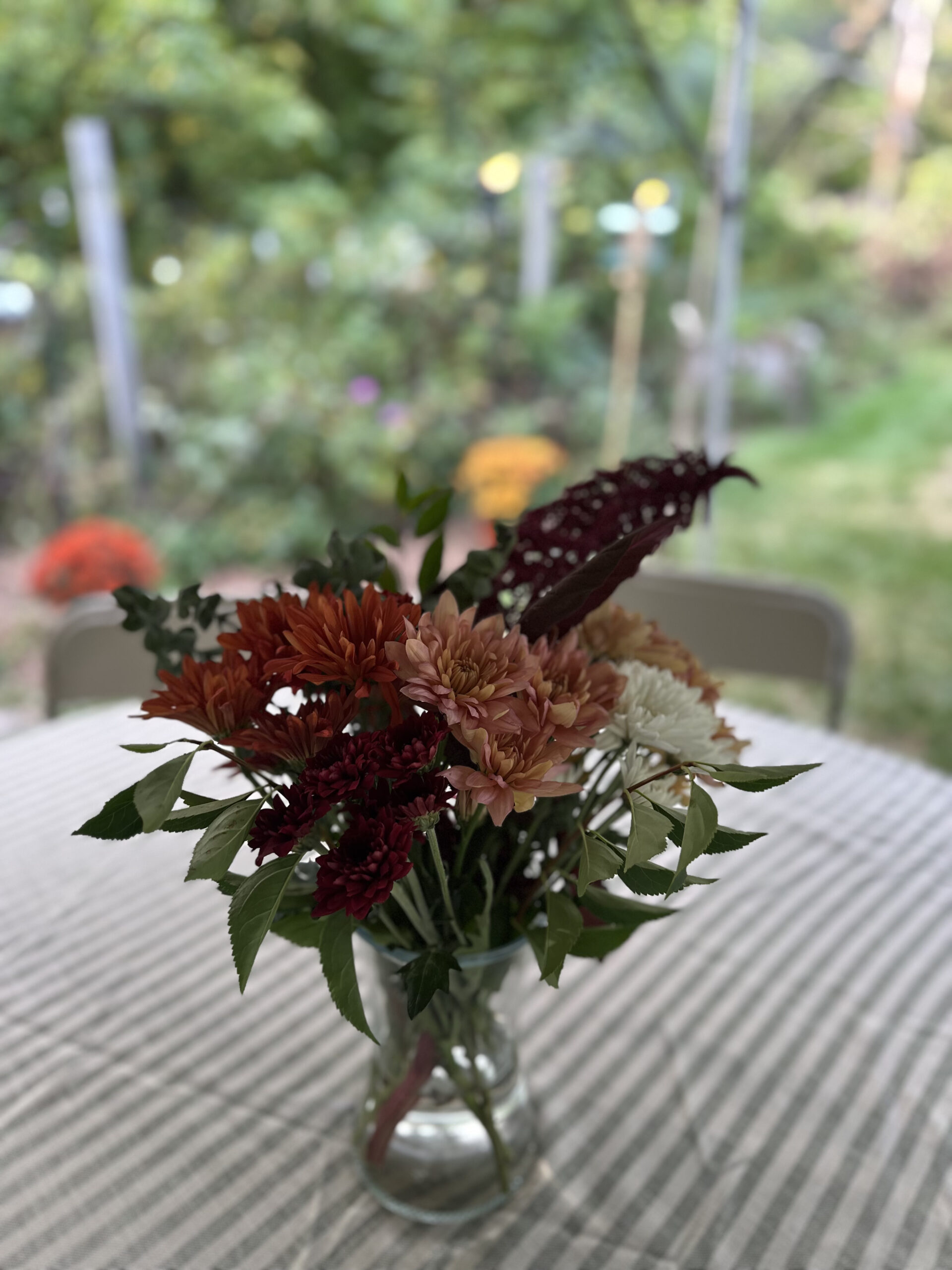 Fall Florals in Vase on table under tent 40th birthday party