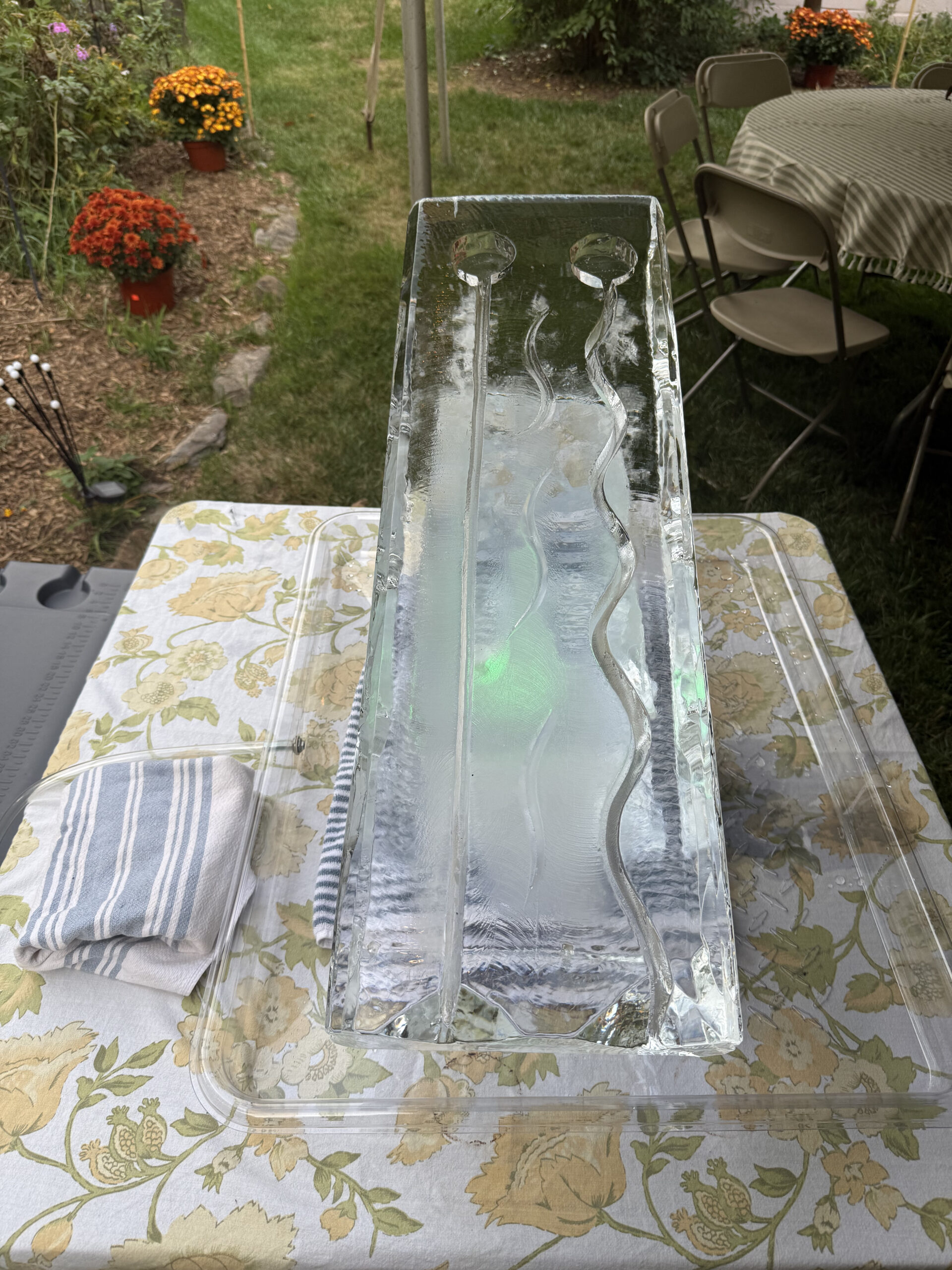 Ice Luge with neon lights on classy table cloth 40th birthday party