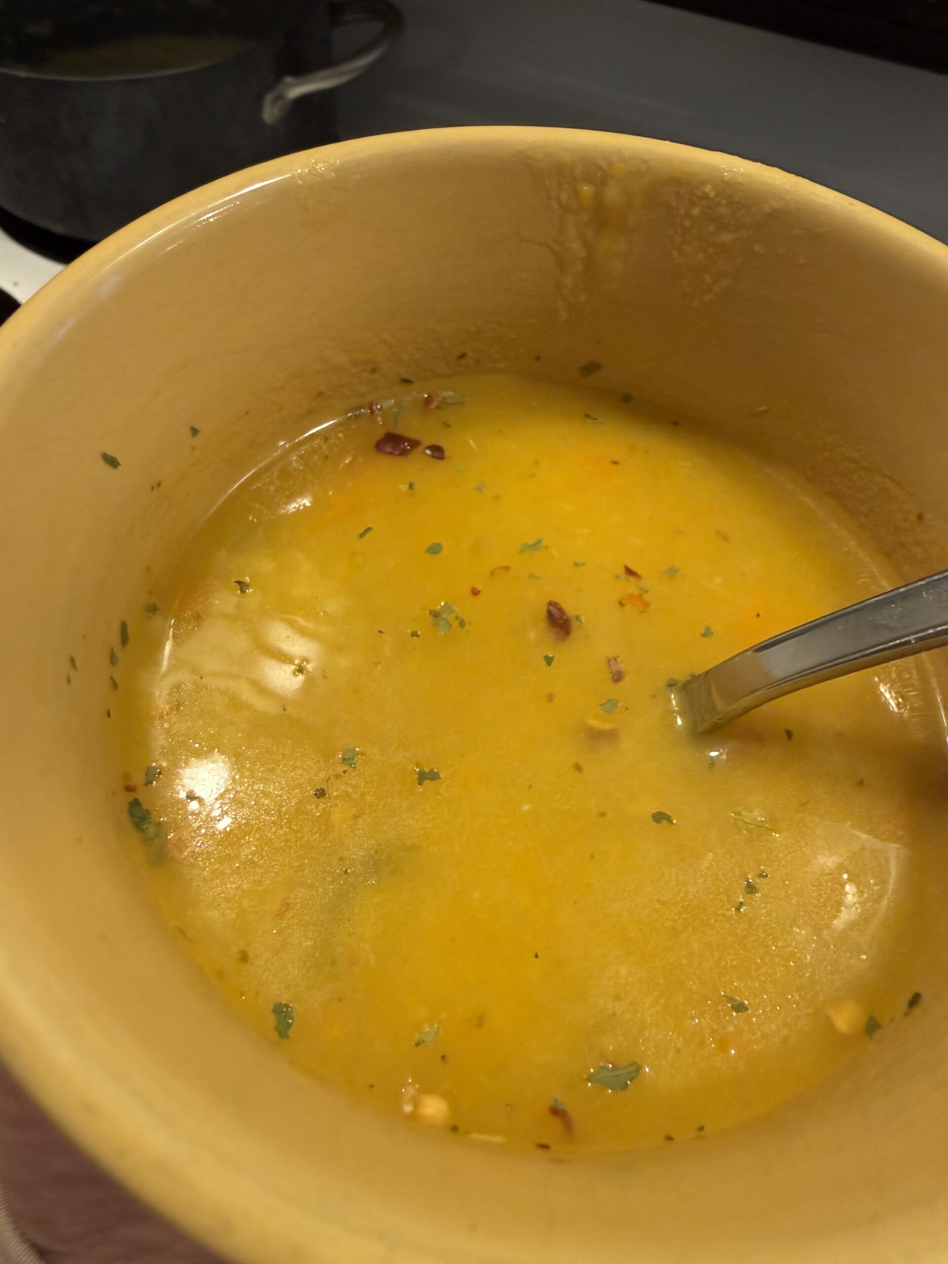 homemade potato soup in a yellow bowl