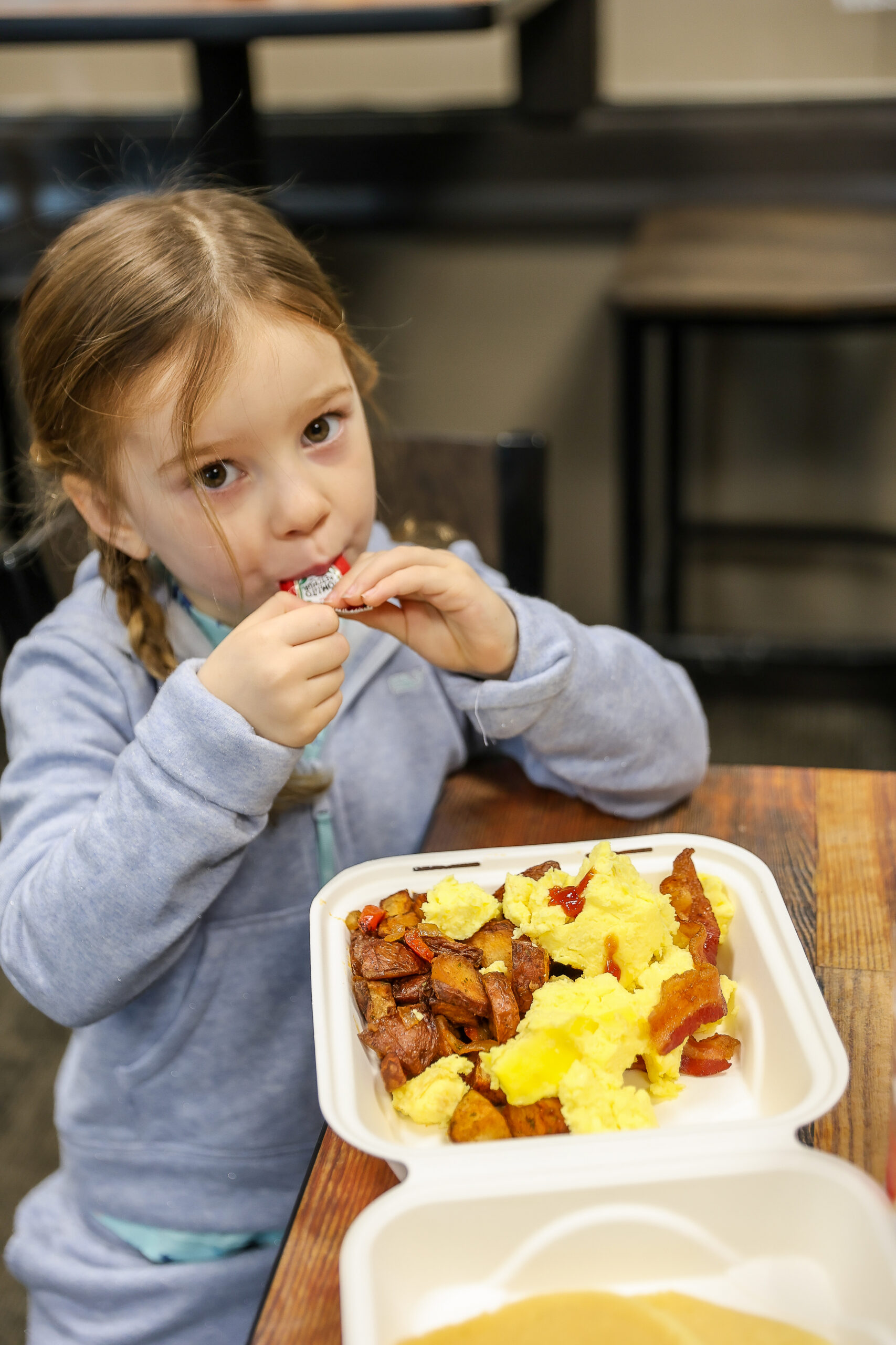 toddler eating breakfast at Grand Country Deli Mount Snow