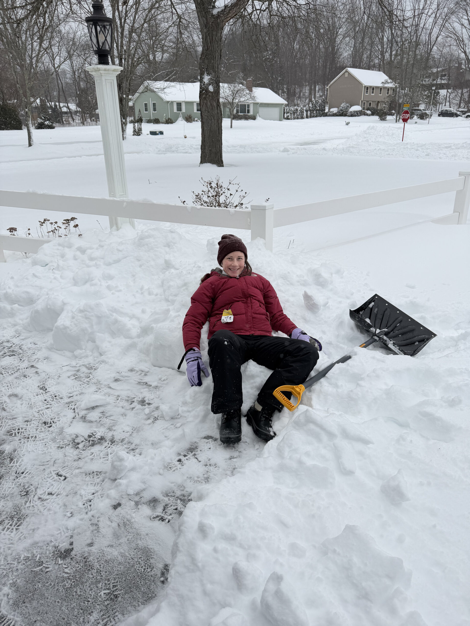 Caitlin laying in snow