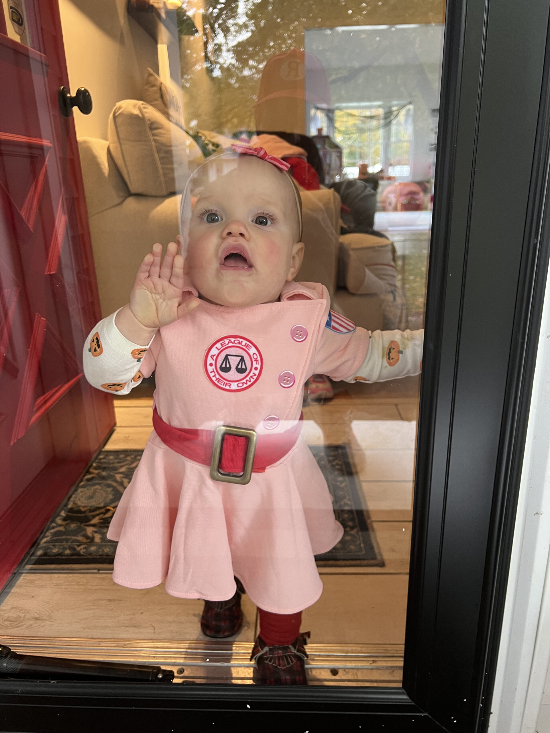 baby smushing face on door trying to get out