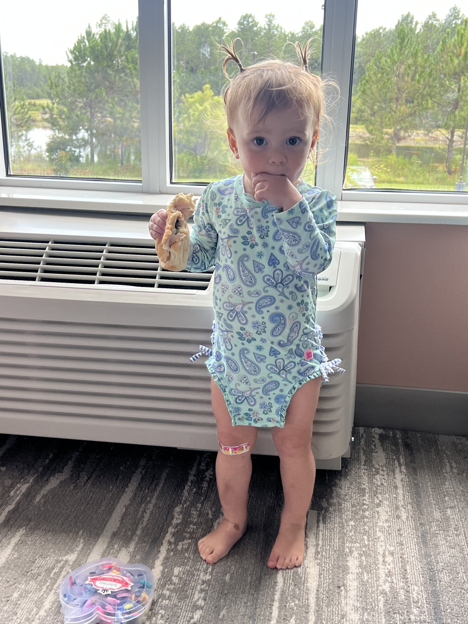toddler eating sandwich bathing suit no pants on freedom to dress herself third child