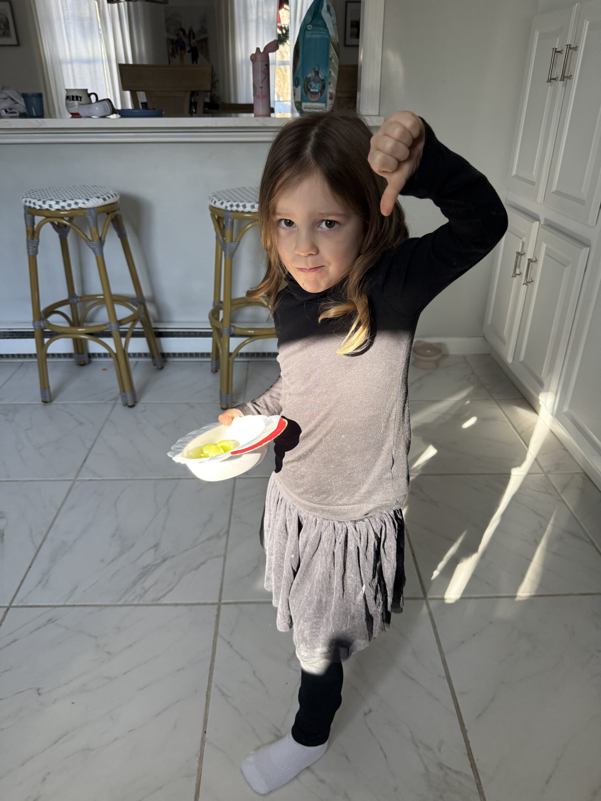 toddler giving a thumbs down