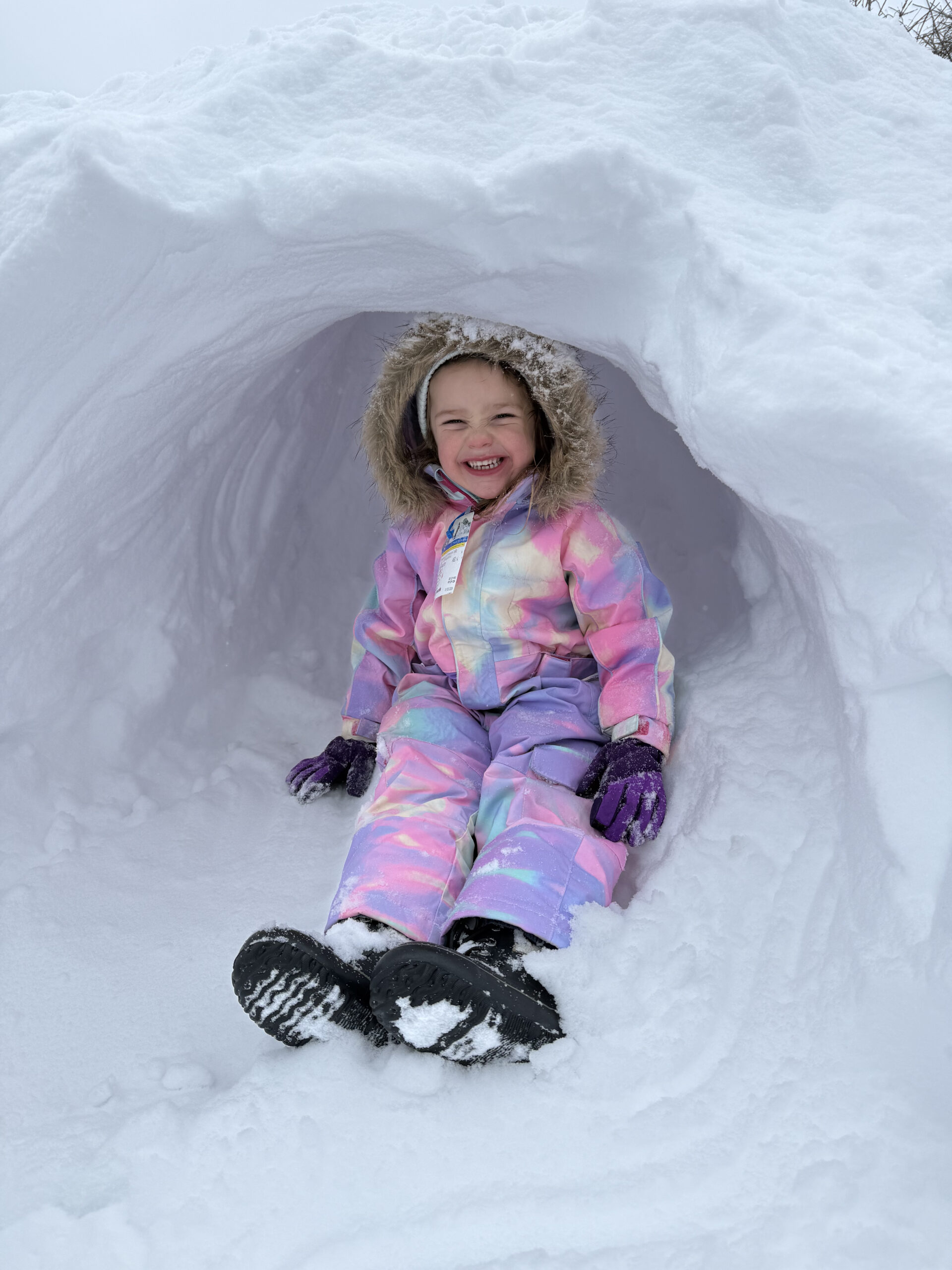 toddler in a snow cave