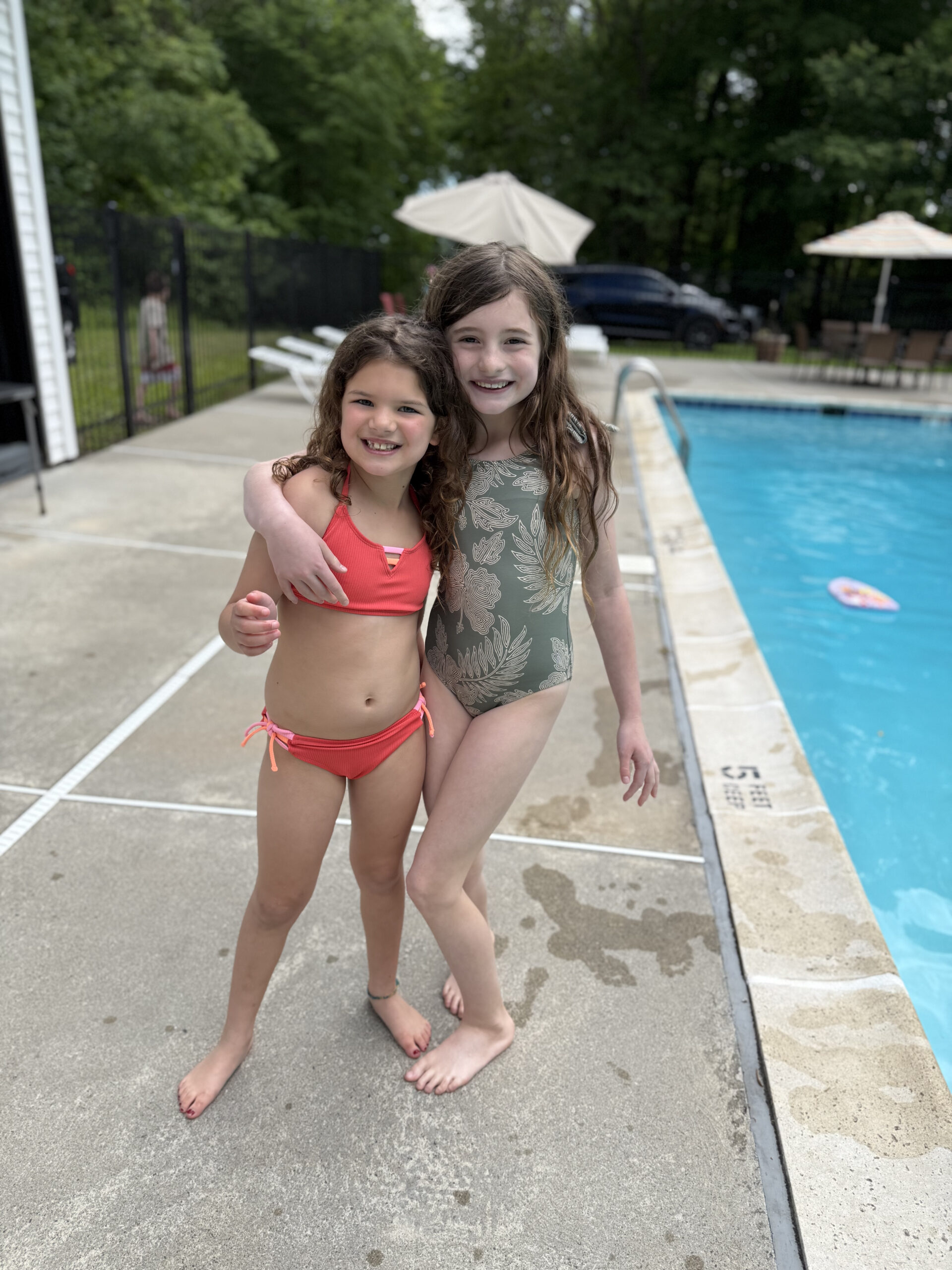 cousins at opening day for neighborhood pool