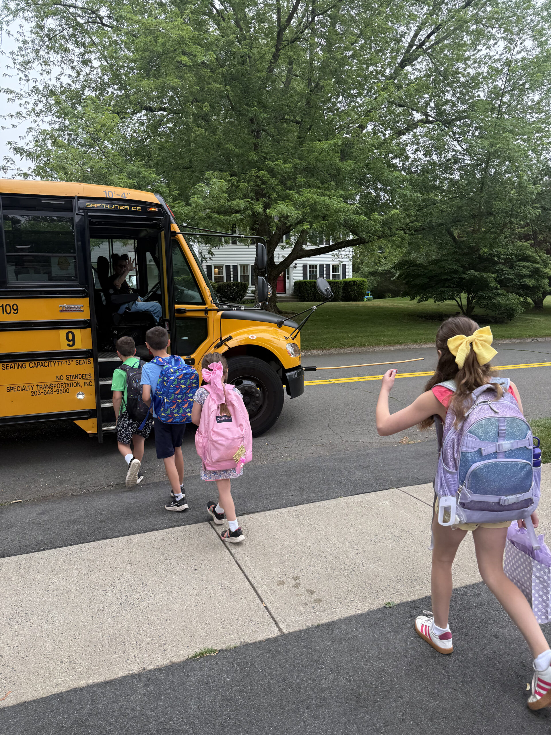kids walking on the bus for the Last day of school 2026