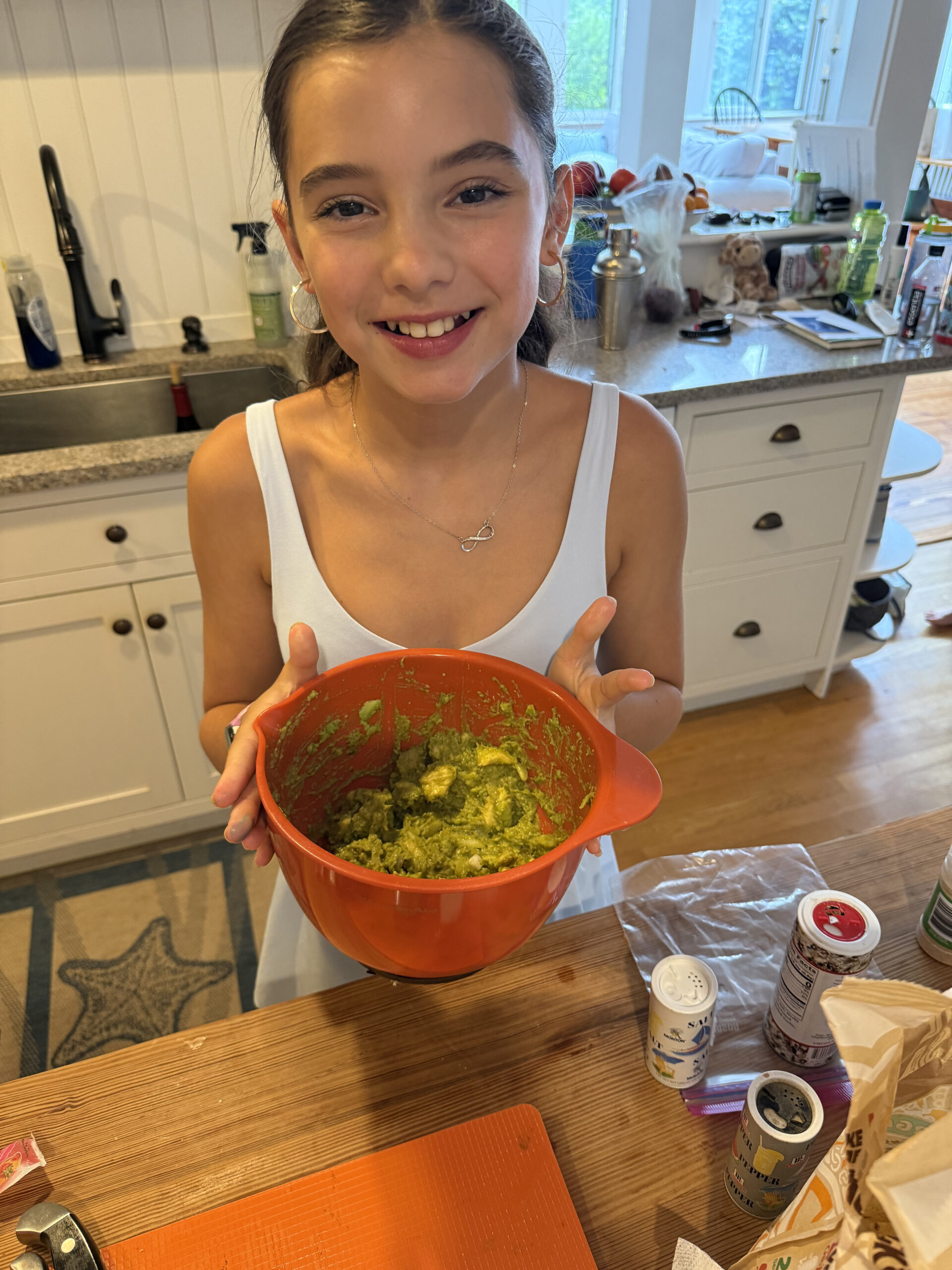 tween girl with bowl of homemade guacamole summer screen free activities