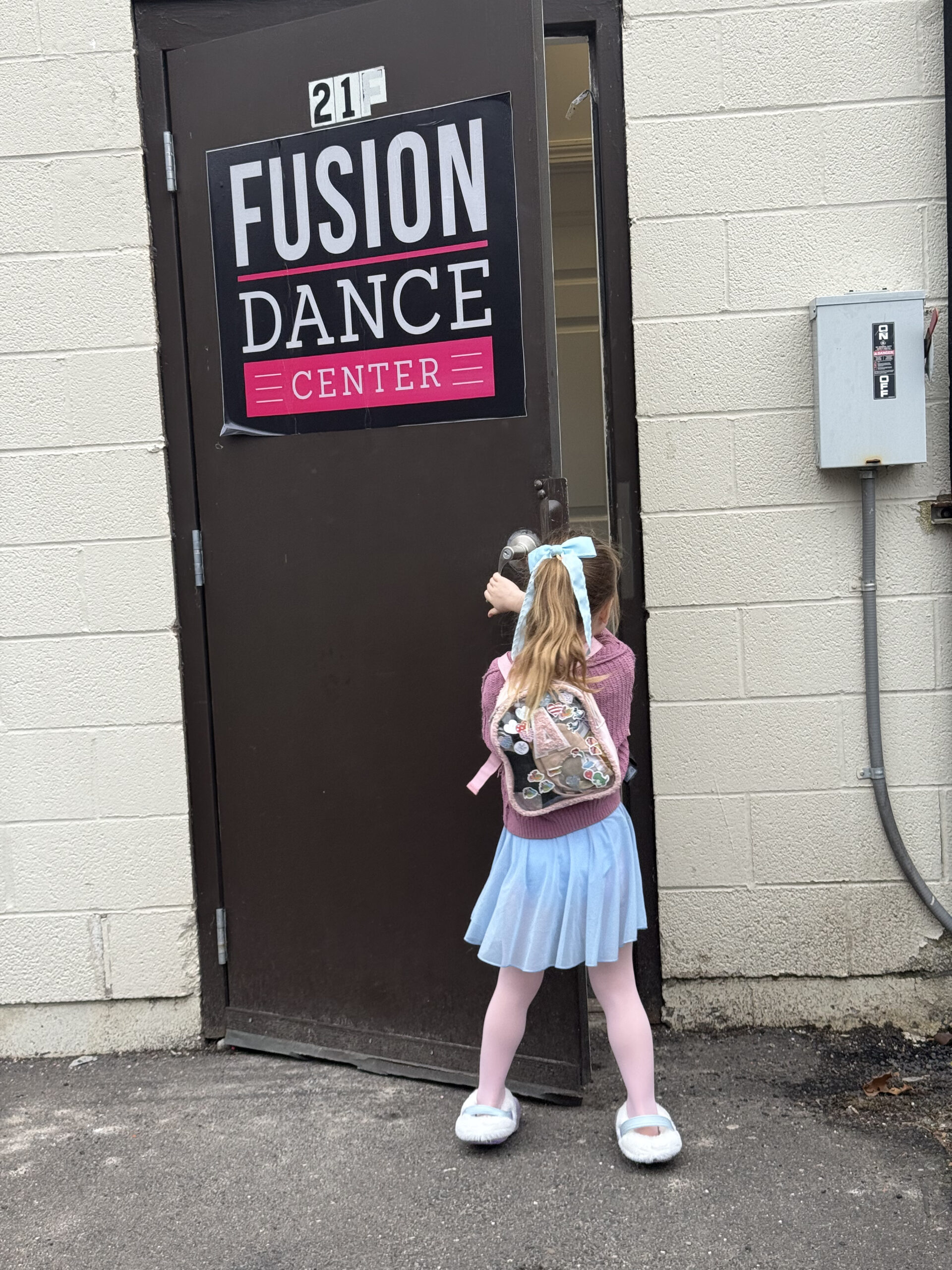 little girl walking into dance studio first dance class
